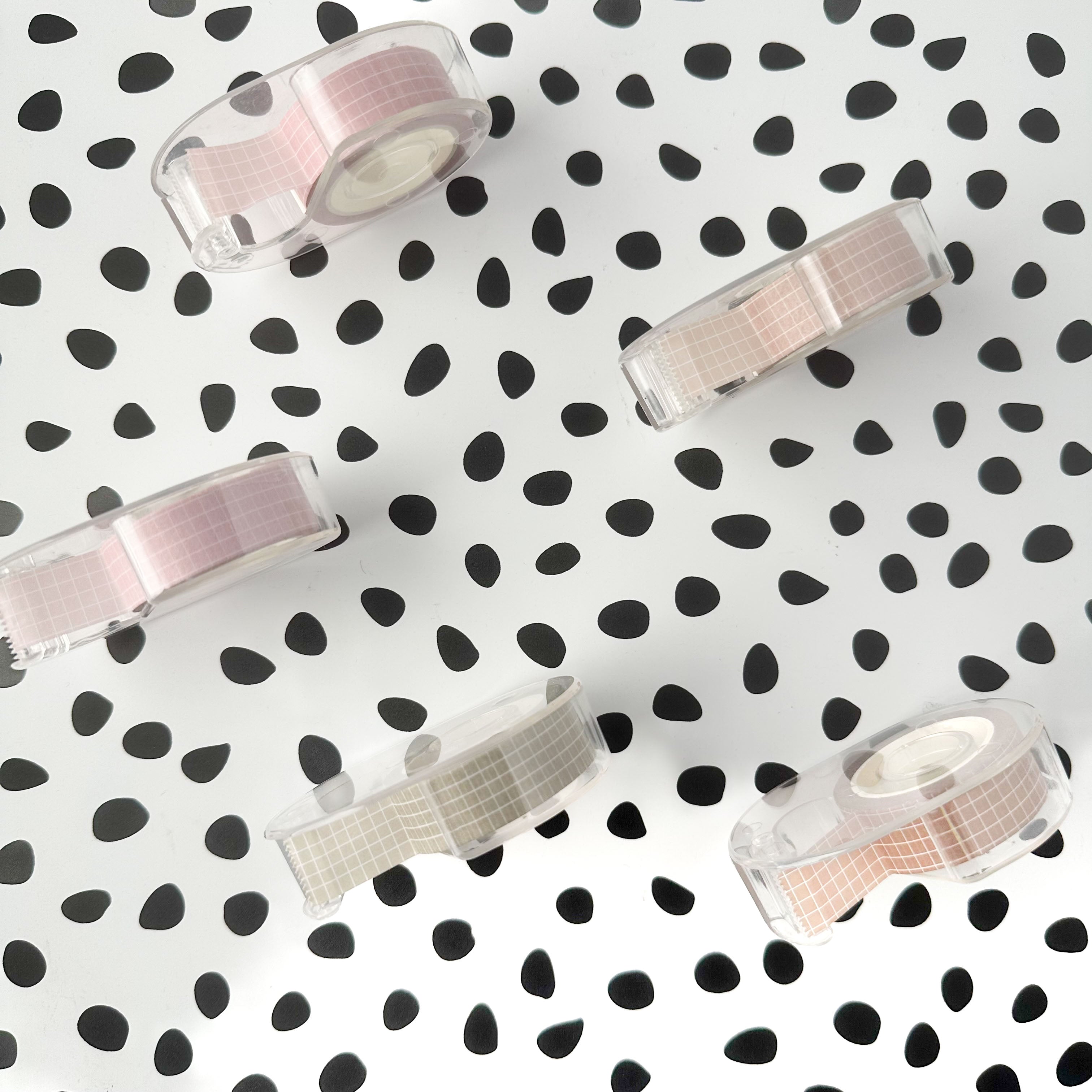 top view of Clear plastic washi tape cutter designed for one standard roll