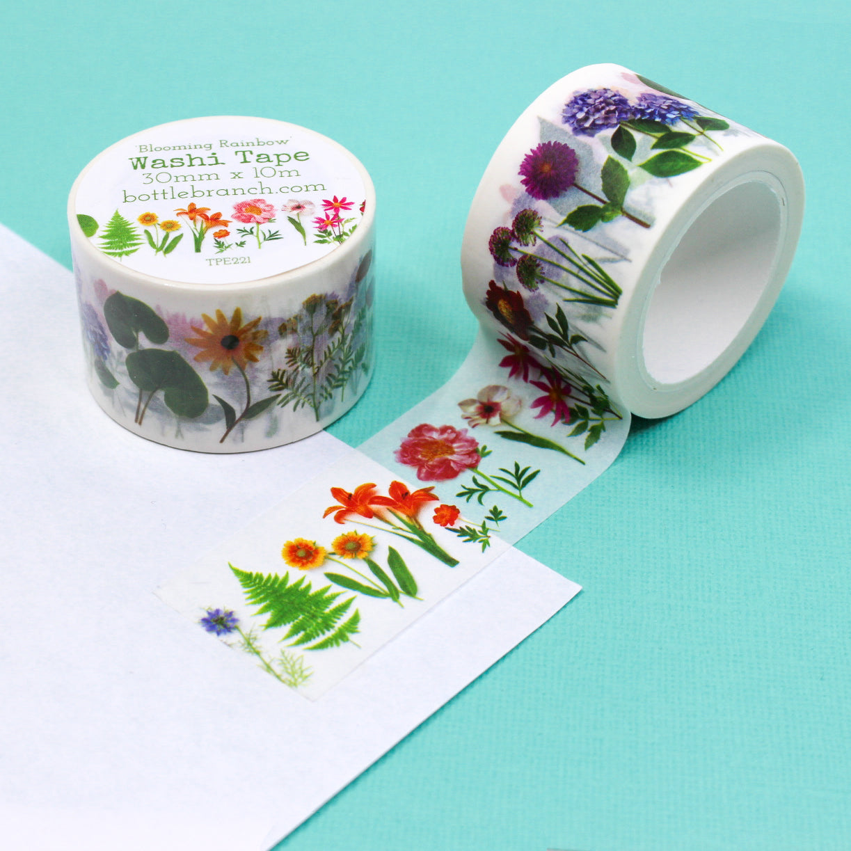 Add a burst of color to your crafts with our vibrant rainbow floral washi tape, featuring a variety of flowers in a spectrum of vibrant hues. Embrace the beauty of nature's palette with our rainbow floral washi tape. This tape is designed by Bottle Branch and sold at BBB Supplies Craft Shop.