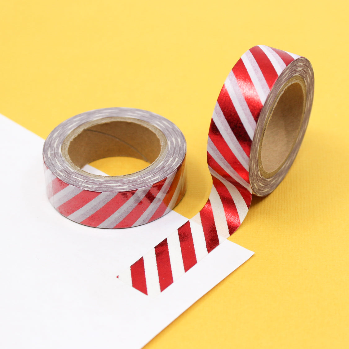 Add a touch of sophistication to your crafts with our diagonal stripe foil washi tape, featuring sleek diagonal stripes in shimmering foil, perfect for creating elegant and eye-catching accents. This tape is sold at BBB Supplies Craft Shop.