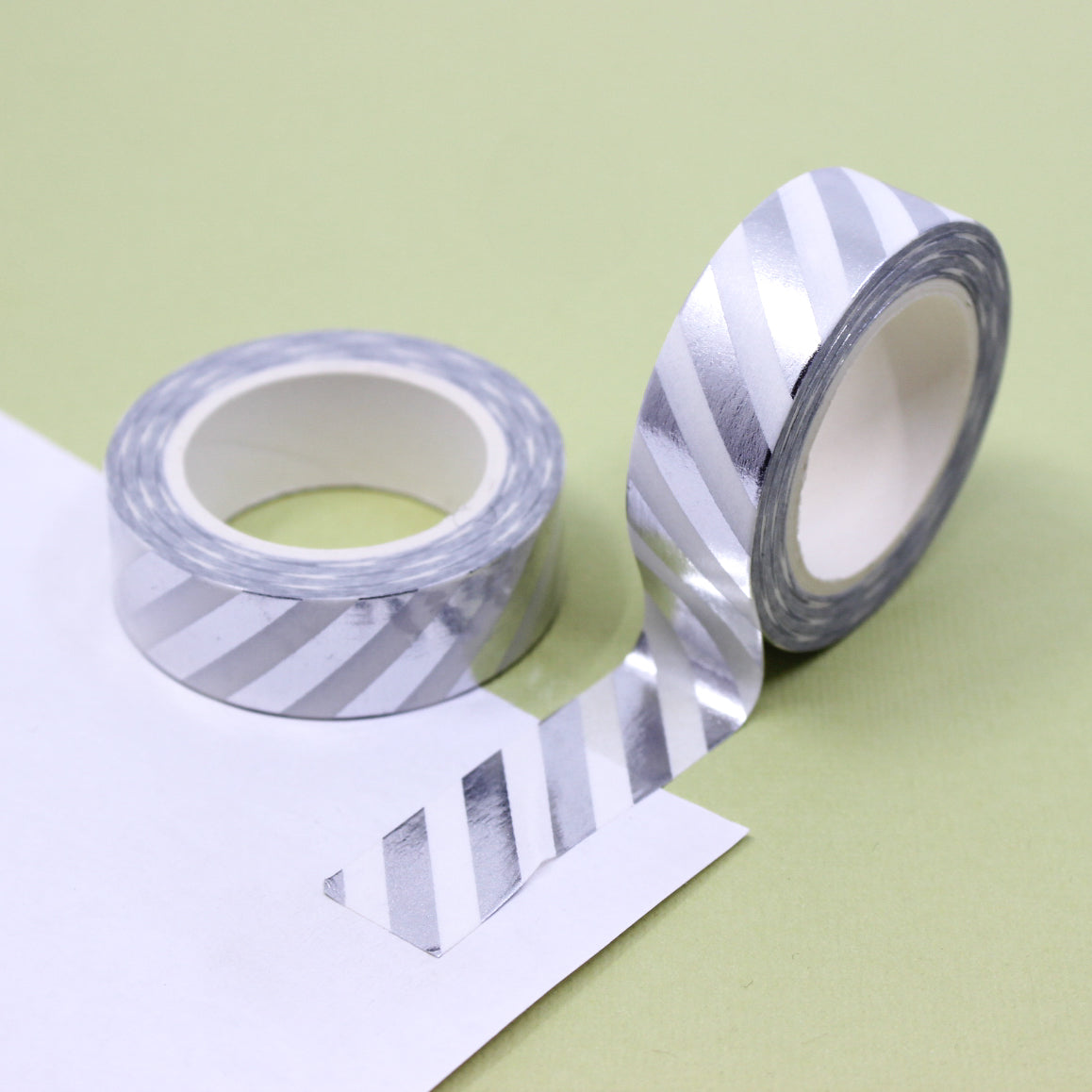Elevate your creations with our captivating diagonal stripe foil washi tape, showcasing dynamic diagonal stripes in metallic foil that bring a sense of luxury and texture to your projects. This tape is sold at BBB Supplies Craft Shop.