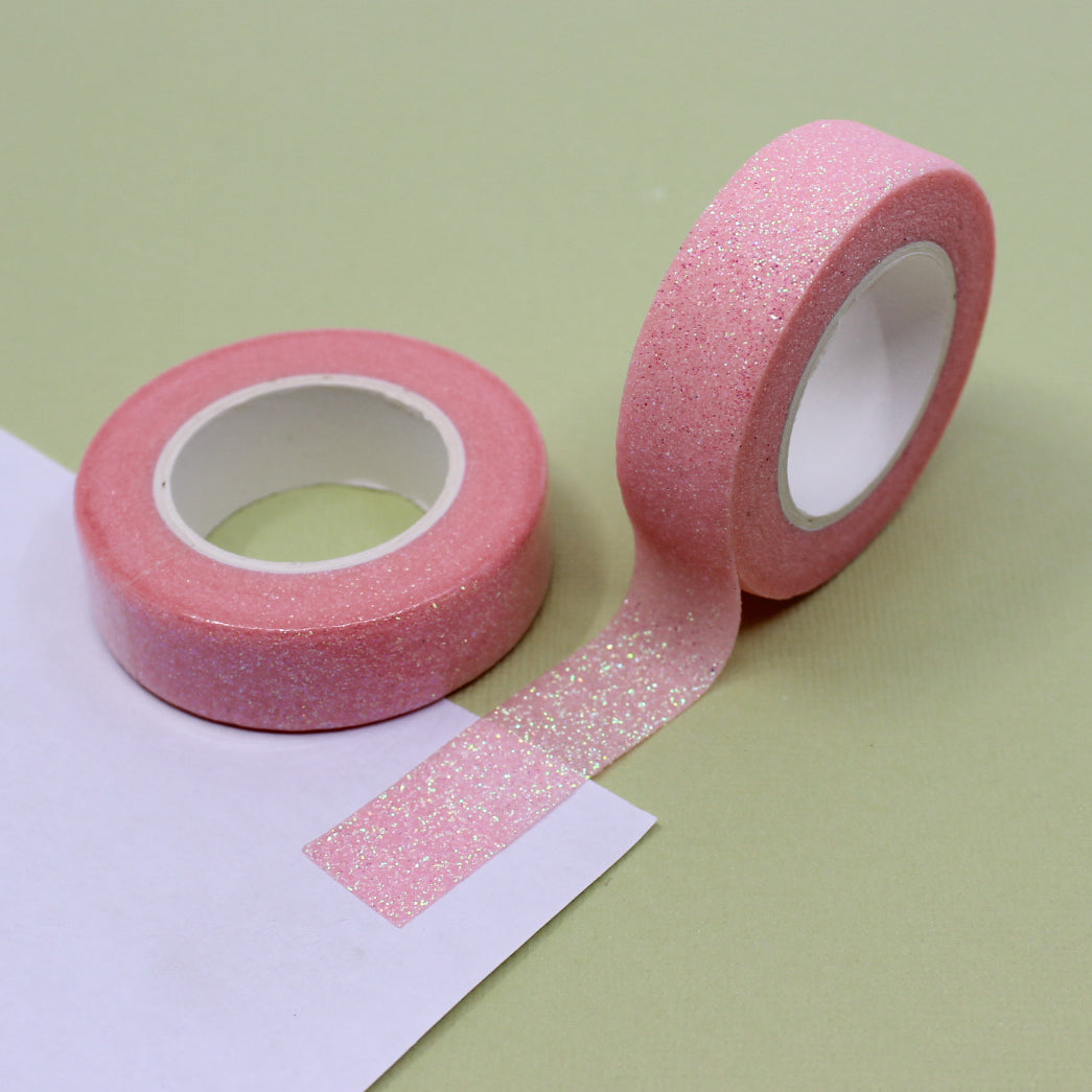 Capture the spirit of love with our Valentine's glitter washi tape, featuring sparkling hearts and romantic motifs in shades of red and pink, perfect for adding a touch of heartfelt sparkle to your crafts. This tape is sold at BBB Supplies Craft Shop.