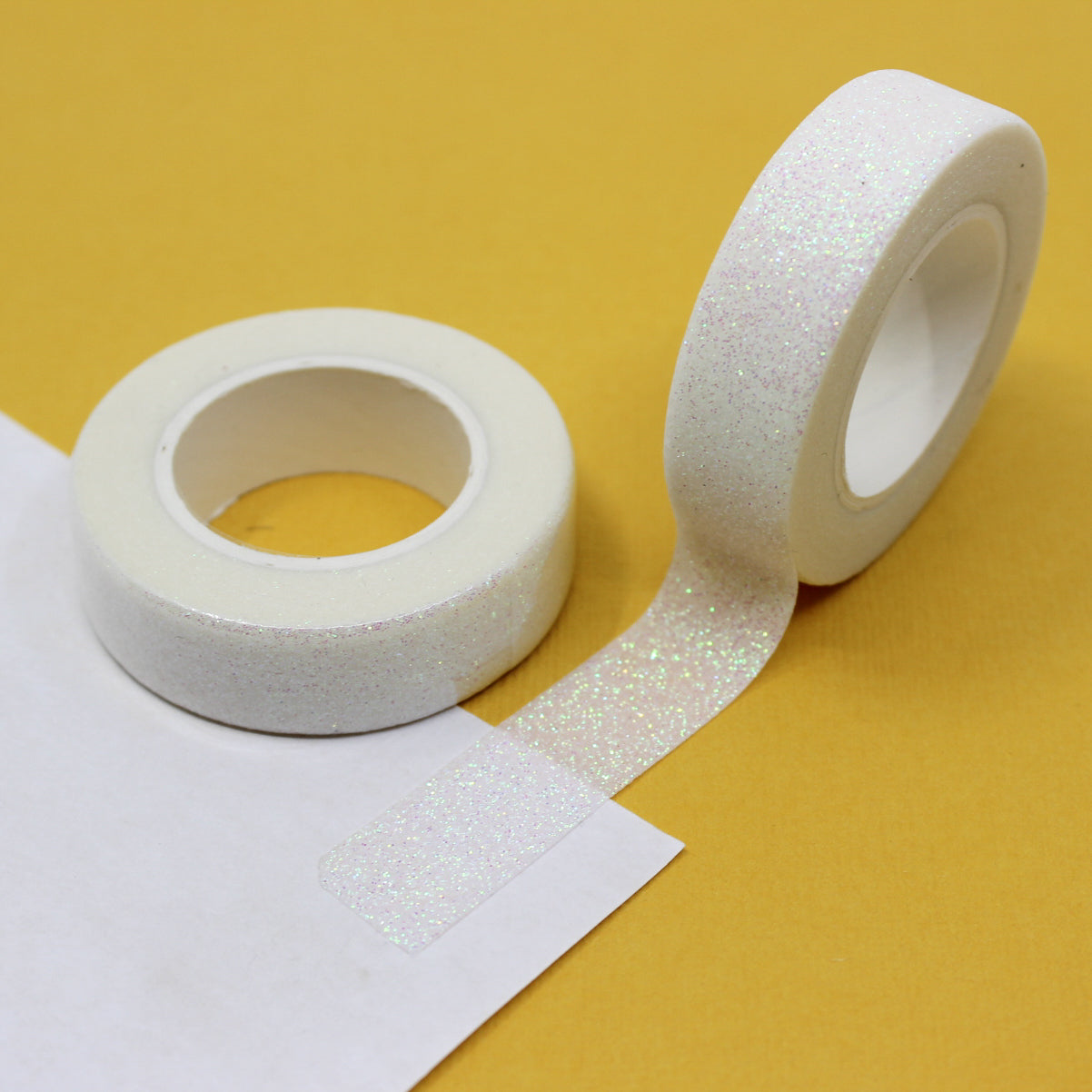 Capture the spirit of love with our Valentine's glitter washi tape, featuring sparkling hearts and romantic motifs in shades of red and pink, perfect for adding a touch of heartfelt sparkle to your crafts. This tape is sold at BBB Supplies Craft Shop.