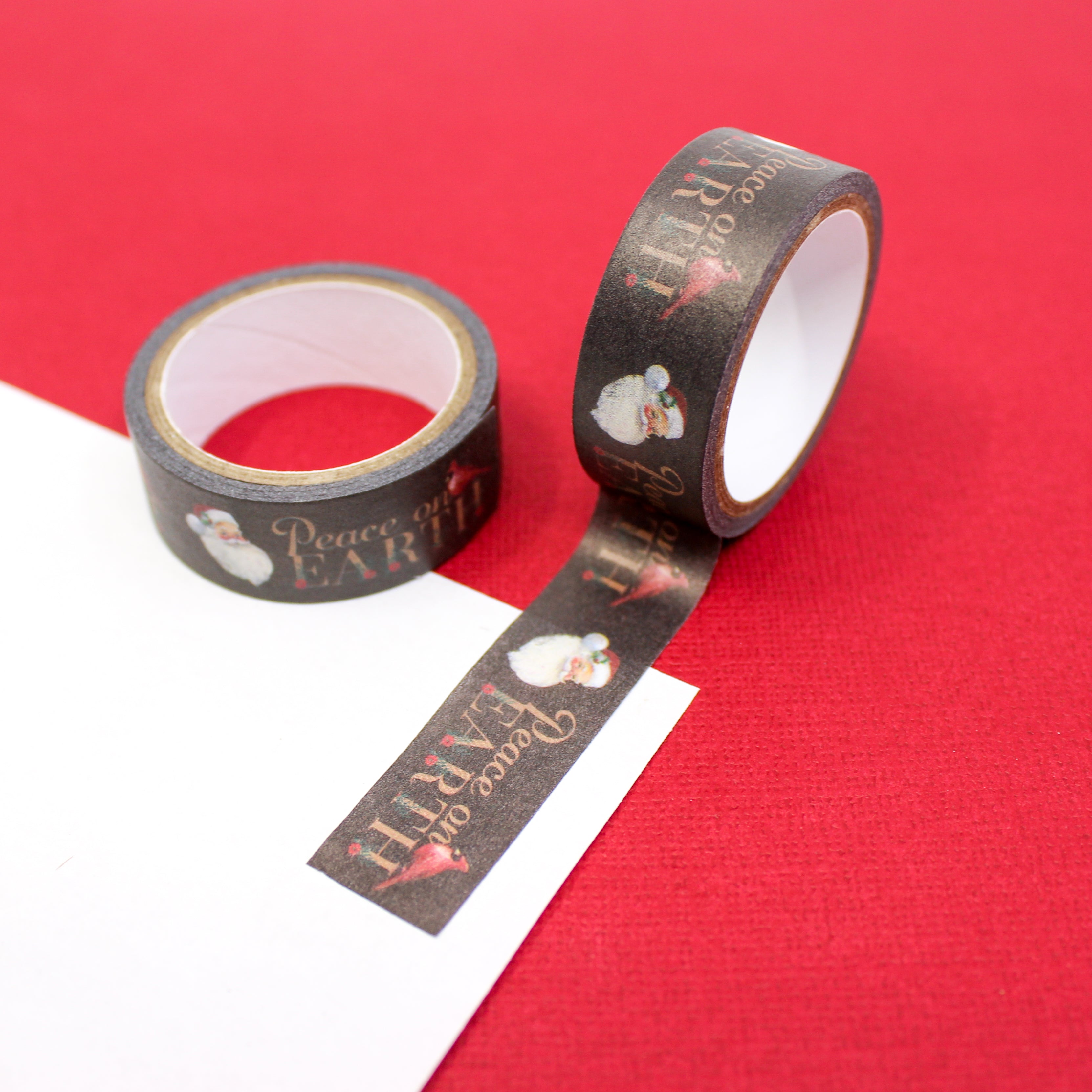 Transport your crafts to a bygone era with our vintage Santa tape, featuring a nostalgic Santa Claus illustration alongside the heartwarming 'Peace on Earth' phrase, perfect for adding a touch of yesteryear charm to your projects. This tape is sold at BBB Supplies Craft Shop.