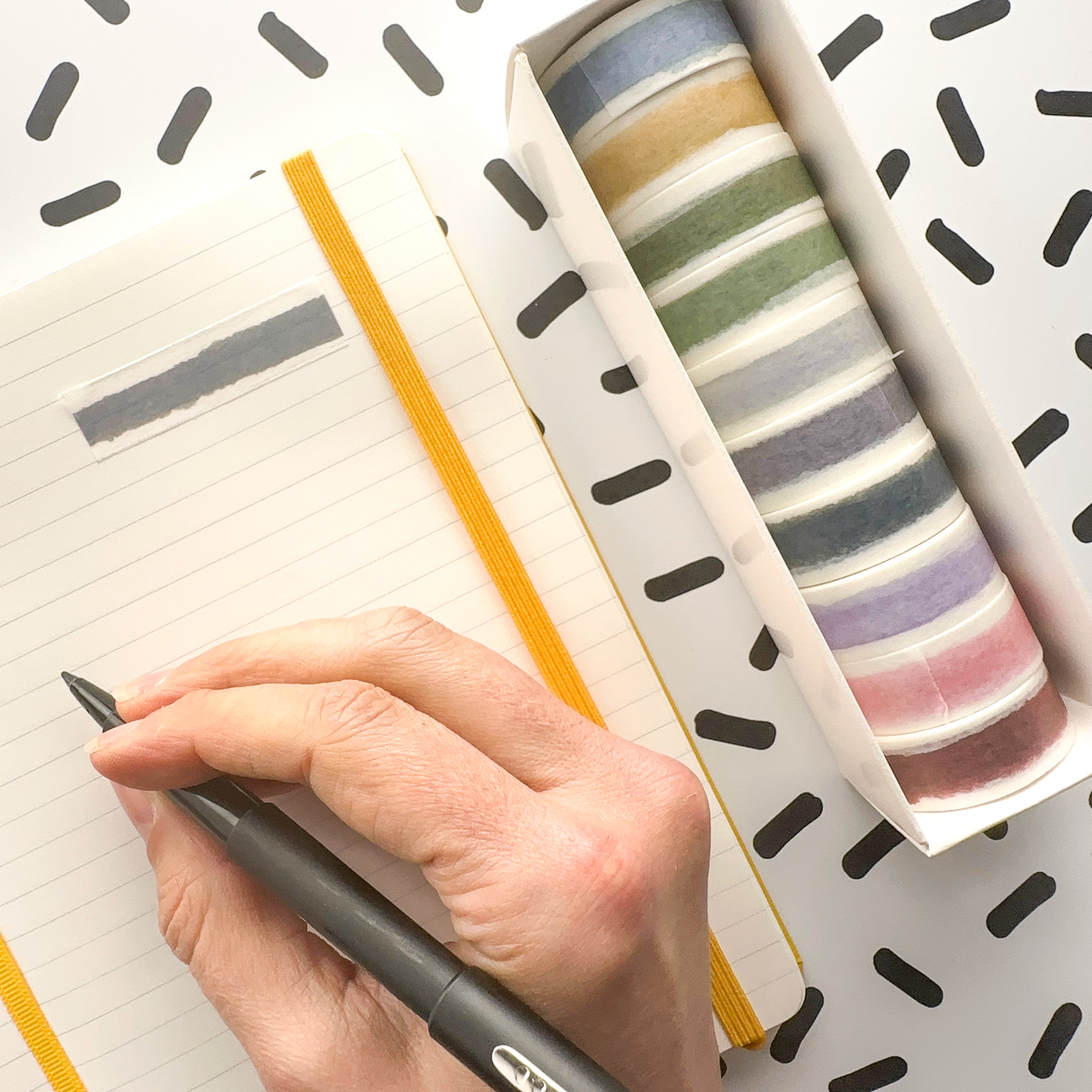 Get creative with our collection of 10 watercolor washi tapes in a beautiful rainbow palette, ideal for scrapbooking, journaling, and DIY crafts. These are especially perfect for easy banners on your spread. This collection is sold at BBB Supplies Craft Shop.