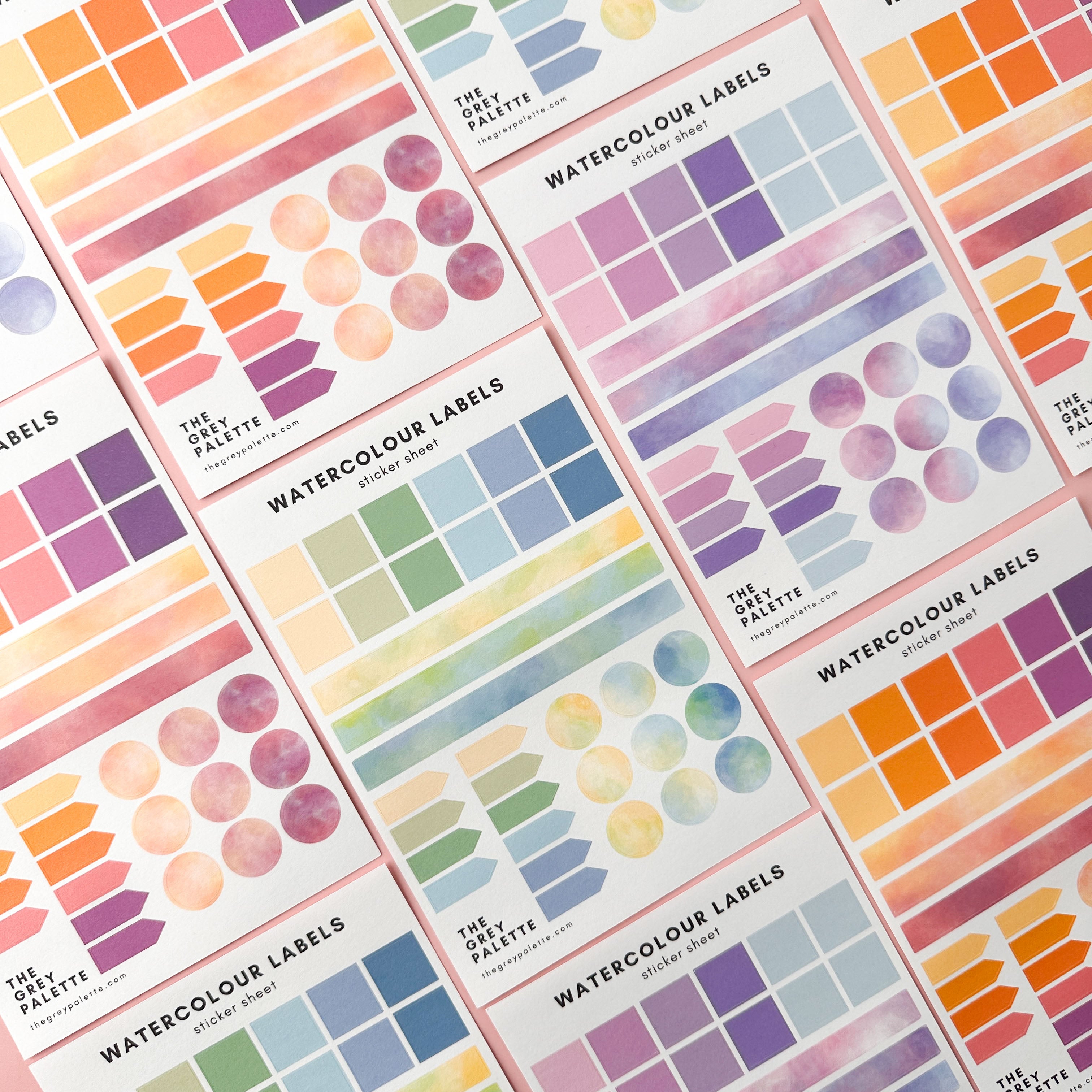 Watercolor planner sticker sheets with assorted labels in square, rectangle, arrow, and circle shapes in soft, pastel tones.