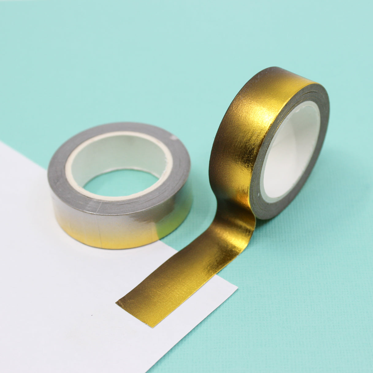 Enhance your crafts with our captivating gold foil ombre to black foil washi tape, featuring a stunning transition from shimmering gold to sleek black for a touch of glamour. This tape is sold at BBB Supplies Craft Shop.