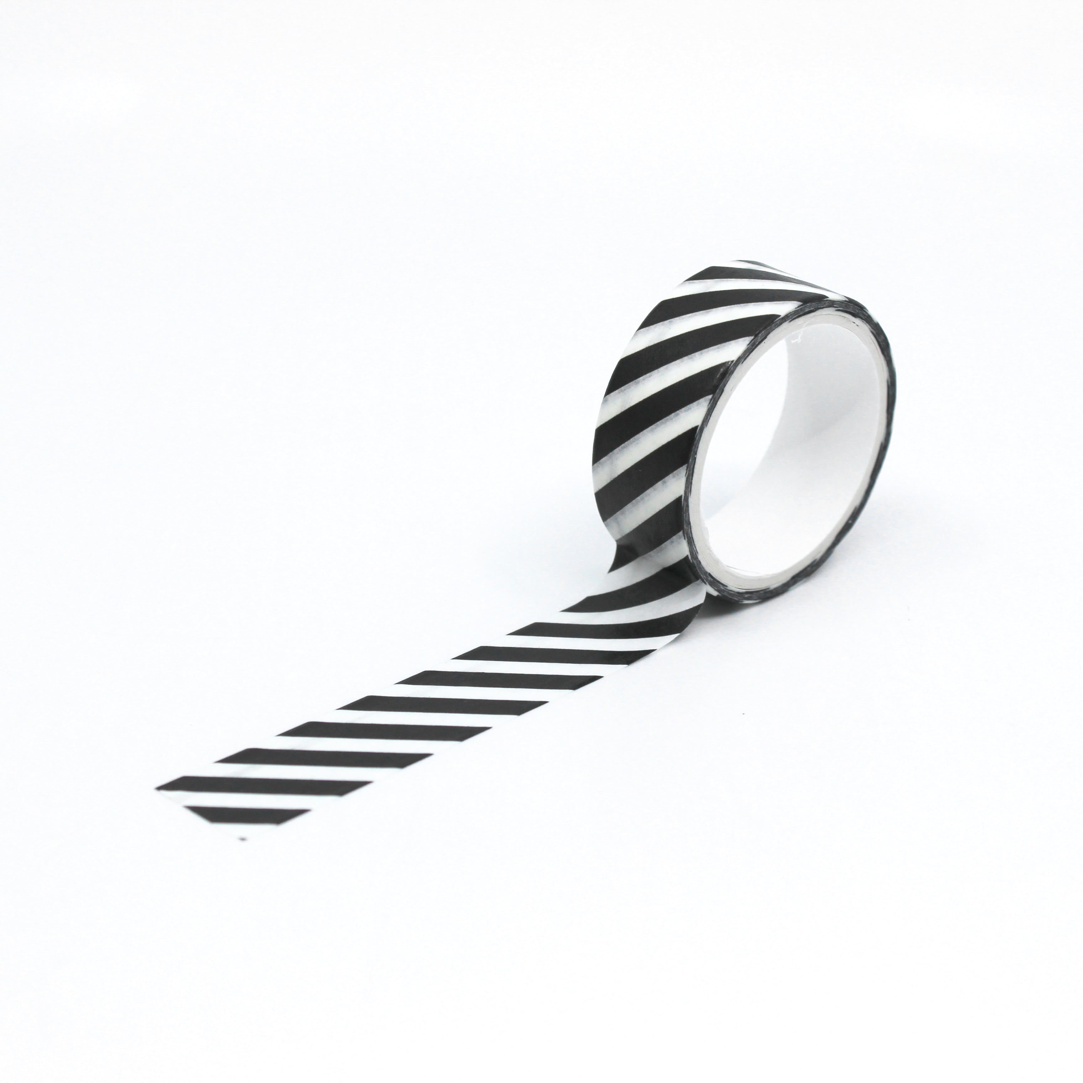 Add a touch of modern sophistication with our black and white striped washi tape, featuring a sleek and stylish pattern of diagonal stripes. This tape is sold at BBB Supplies Craft Shop.