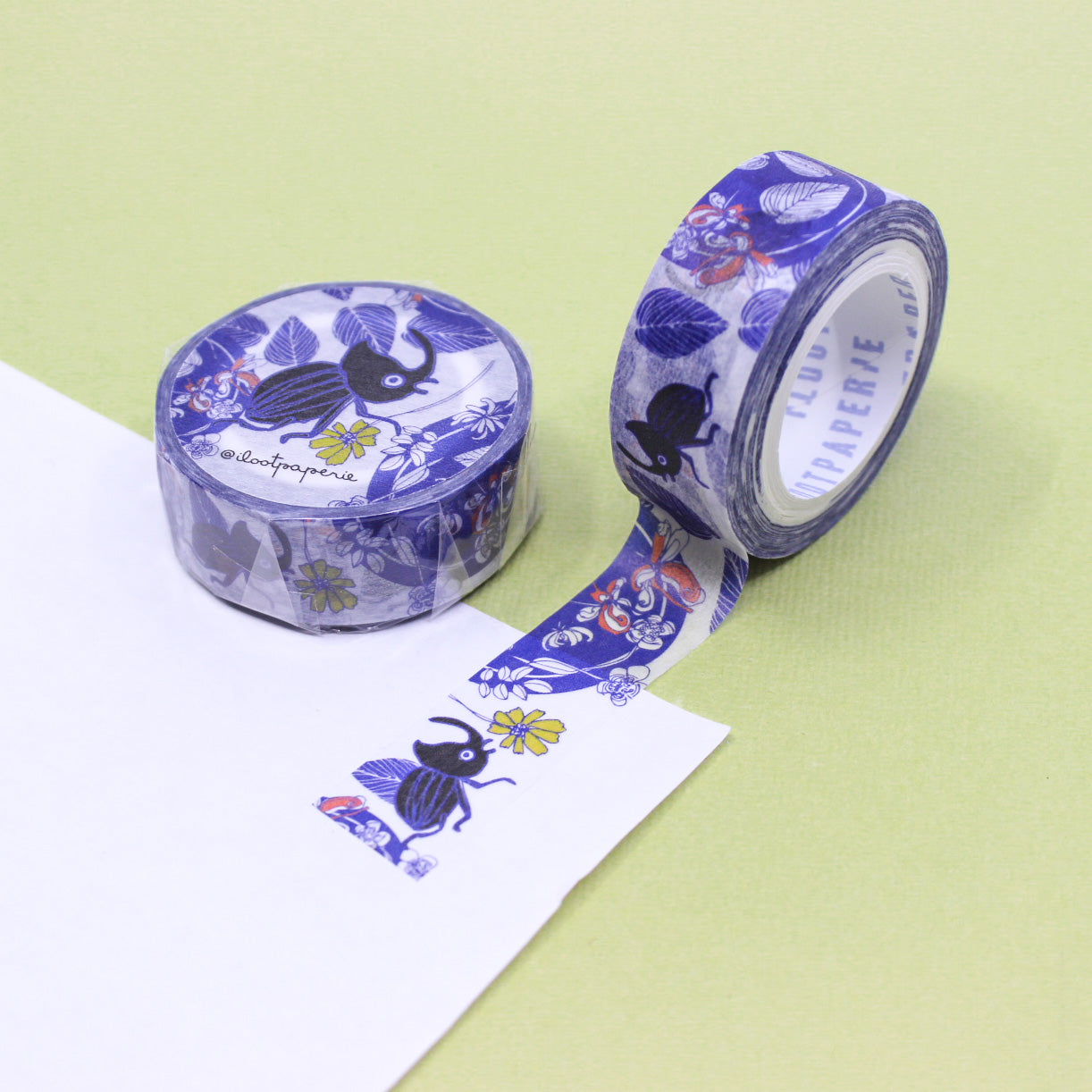 "Blue Beetle Washi Tape" features intricately detailed blue beetles against a neutral background, ideal for adding a unique and nature-inspired touch to your scrapbooking, journaling, and DIY crafts.