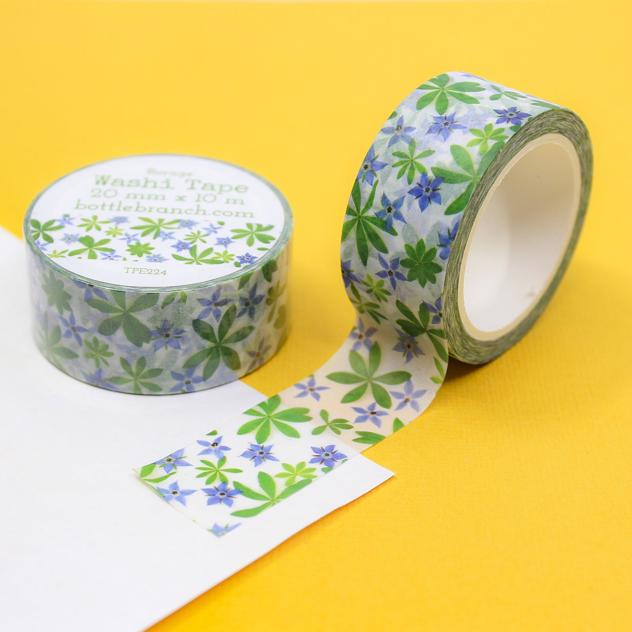 Blue Borage Floral Washi Tape features delicate blue borage flowers against a white background, adding a touch of elegance to your crafts. Perfect for scrapbooking, card making, or journal. This tape is sold at BBB Supplies Craft Shop and designed by Bottle Branch Designs.