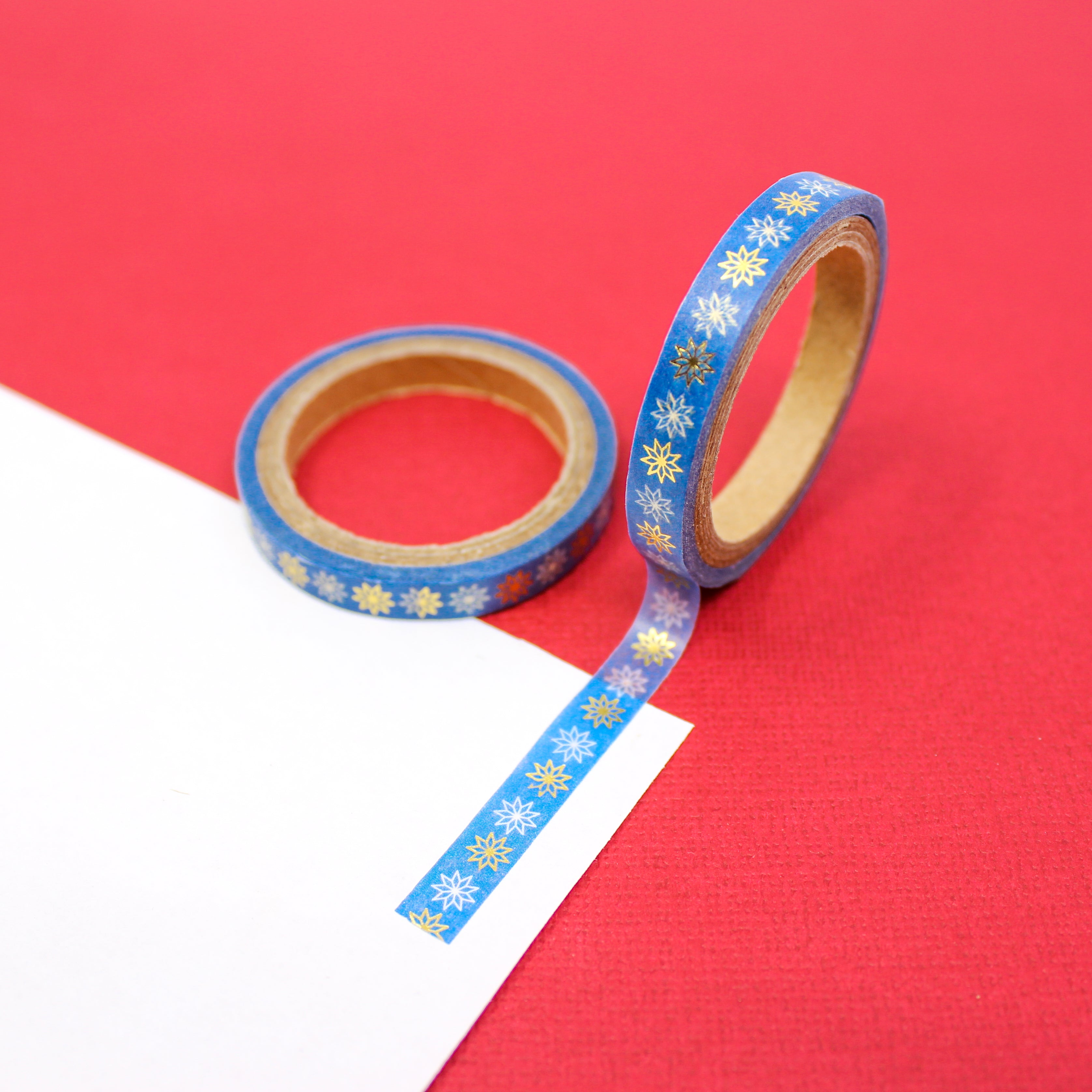Infuse your projects with the enchantment of holiday festivities using our washi tape adorned with blue snowflake patterns, adding a festive and merry element to your crafts. This tape is sold at BBB Supplies Craft Shop.