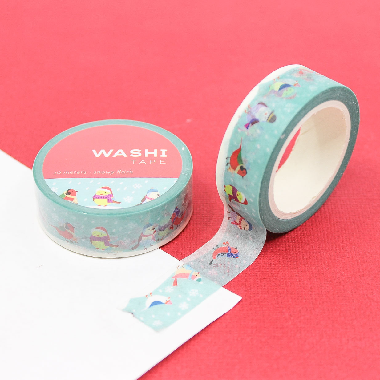 Holiday Caroling Birds Washi Tape featuring cute birds in hats and scarves singing in a snowy scene, perfect for adding a festive, whimsical touch to planners, scrapbooks, and holiday crafts.