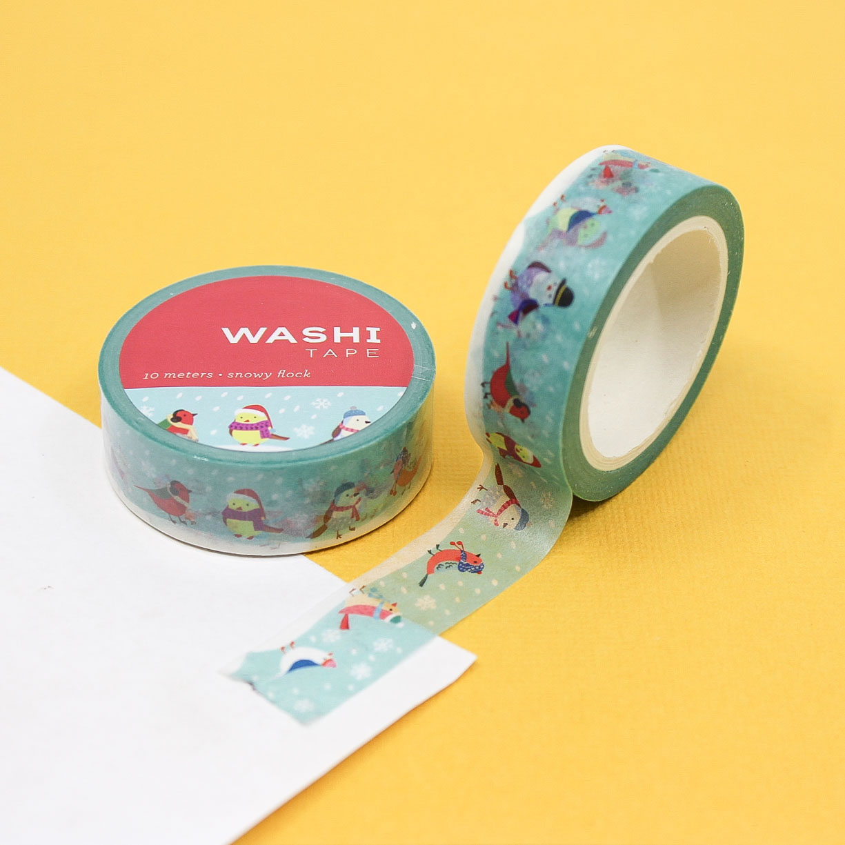 Holiday Caroling Birds Washi Tape featuring cute birds in hats and scarves singing in a snowy scene, perfect for adding a festive, whimsical touch to planners, scrapbooks, and holiday crafts.