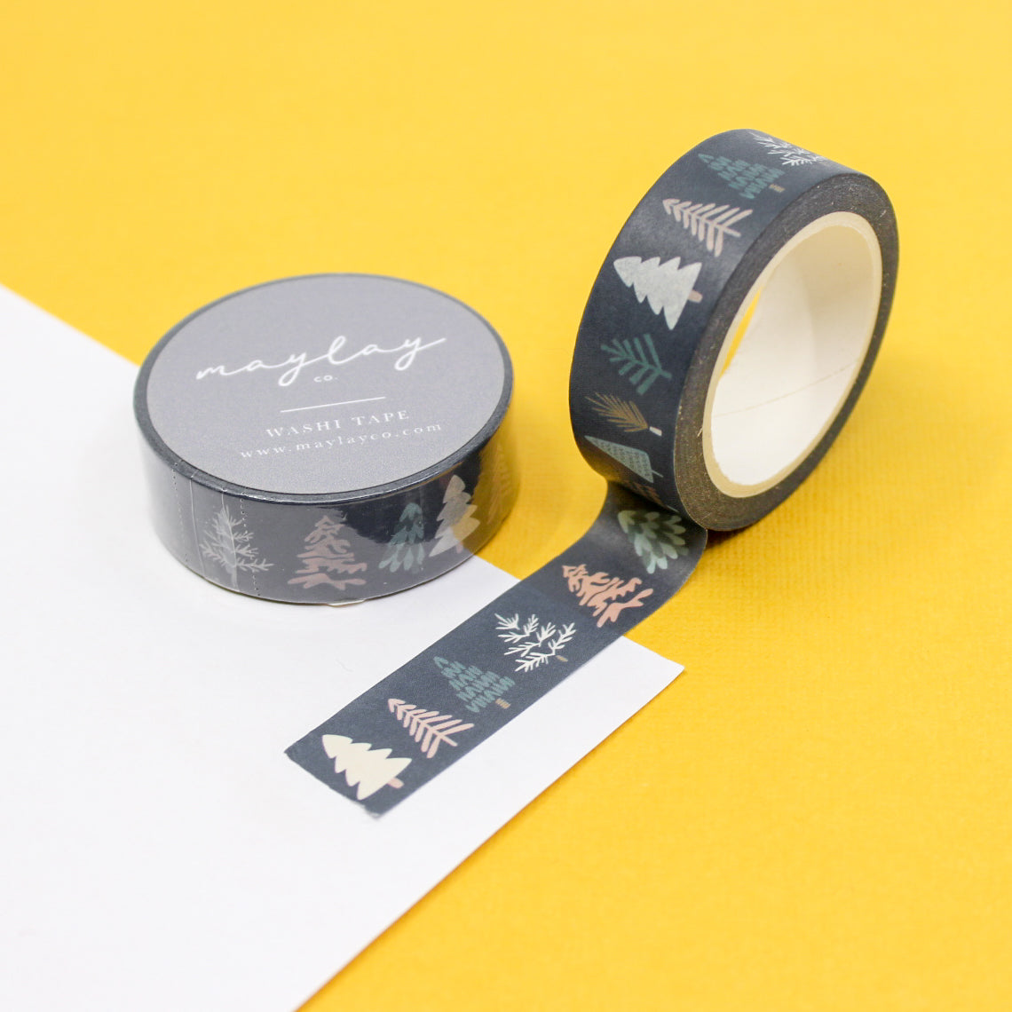 Create a serene holiday ambiance with our Muted Christmas Trees Happy Forest Washi Tape, featuring a peaceful and festive forest of trees. Ideal for adding a touch of Christmas charm to your projects. This tape is from Maylay Co. and sold at BBB Supplies Craft Shop.