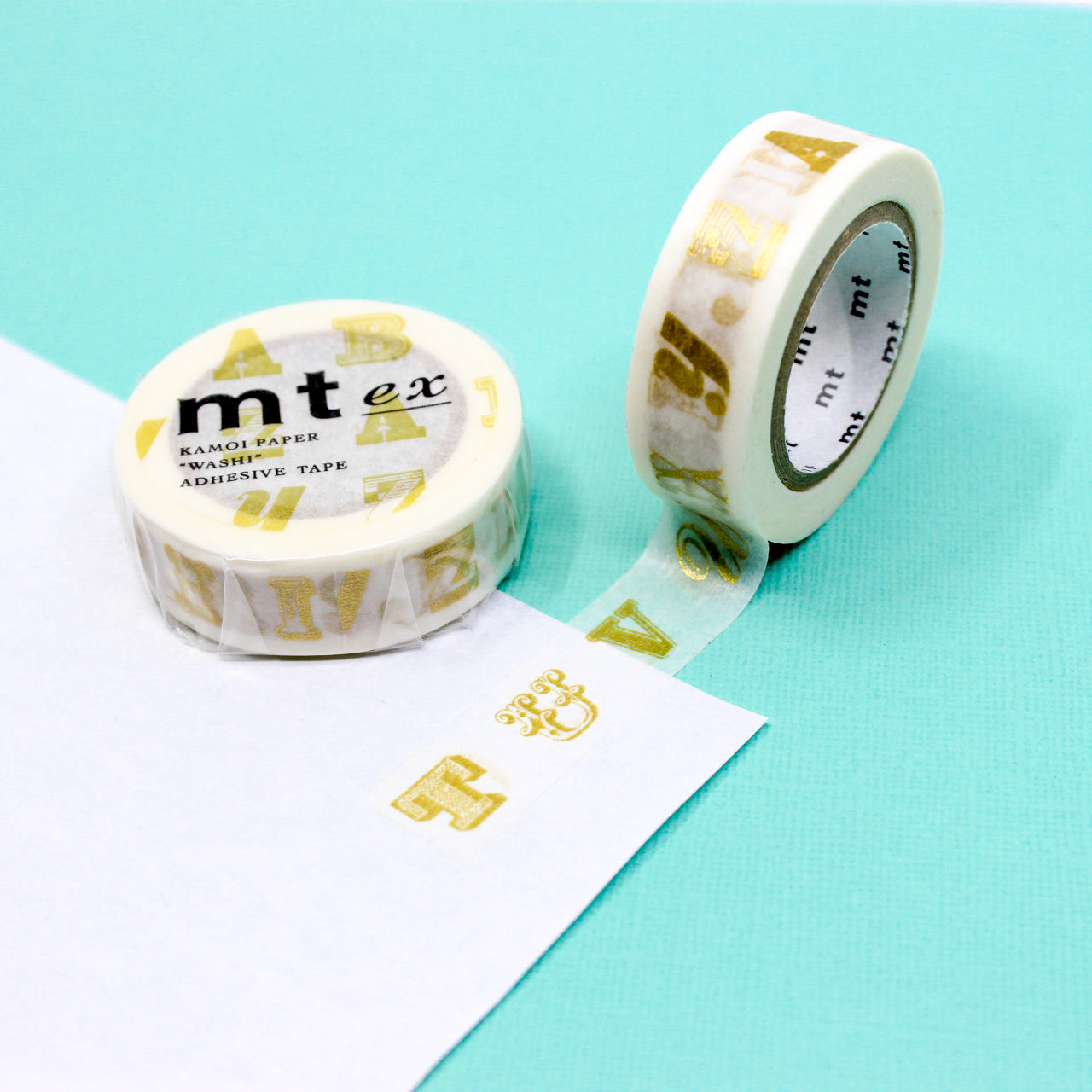 Add a touch of sophistication to your crafts with our gold and black classic typeface washi tape, featuring timeless typography in elegant gold and black hues, perfect for creating refined and stylish accents. This gold alphabet tape is from MT Brand Masking Tape and sold at BBB Supplies Craft Shop.