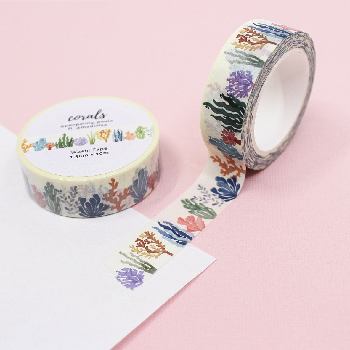 Colorful coral reef washi tape featuring a vibrant pattern of coral in shades of orange, pink, blue, and purple, perfect for decorating journals, planners, and craft projects.