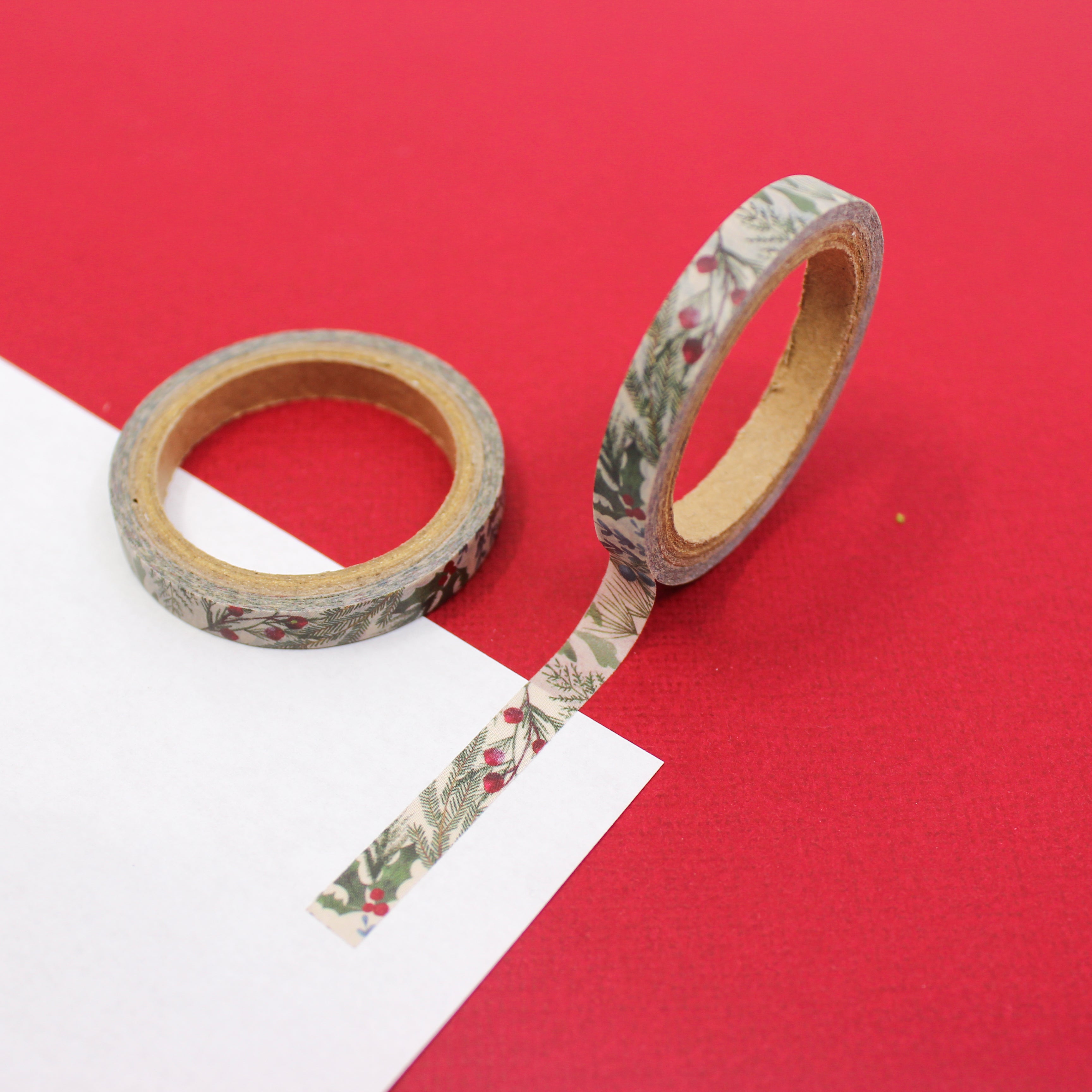 Celebrate the holidays with our holly-themed Washi tape in a slender design, ideal for adding a classic and subtle touch to your crafts, embodying the joy and beauty of holiday foliage. This tape is sold at BBB Supplies Craft Shop.