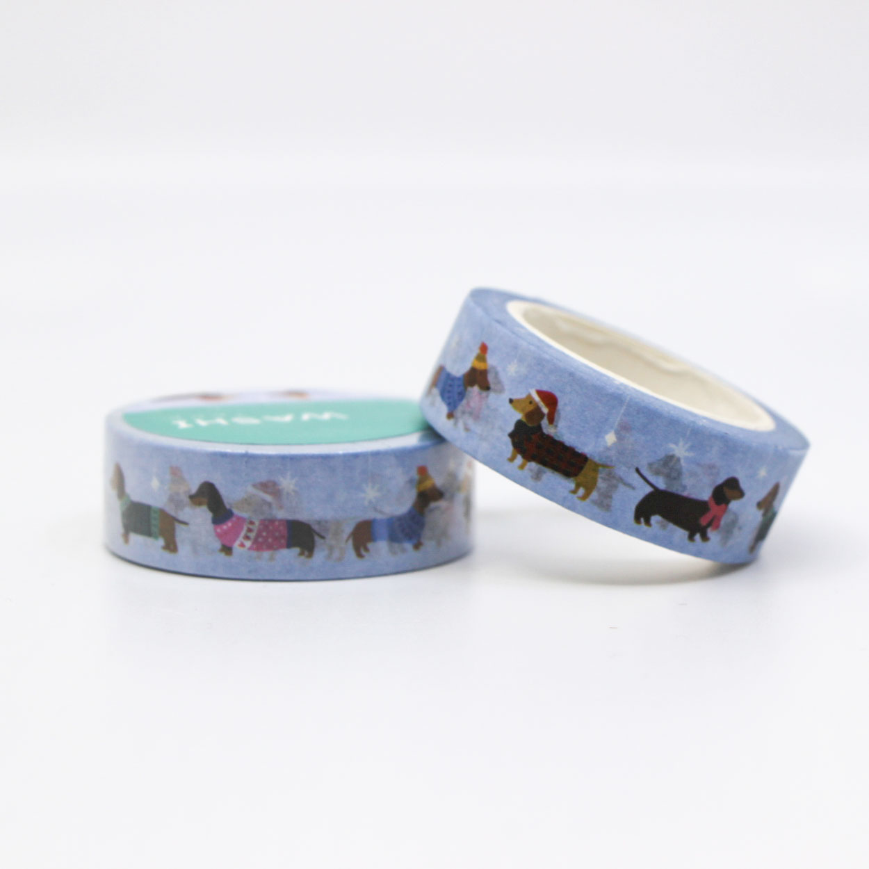 Christmas-themed washi tape with illustrated dogs in sweaters — perfect for planners and crafts.