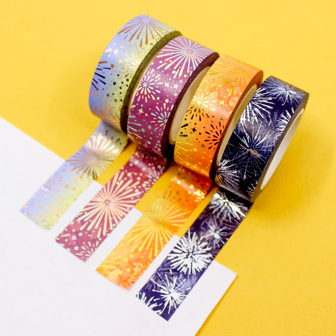 Gold foil fireworks washi tape on red background for holiday decorating