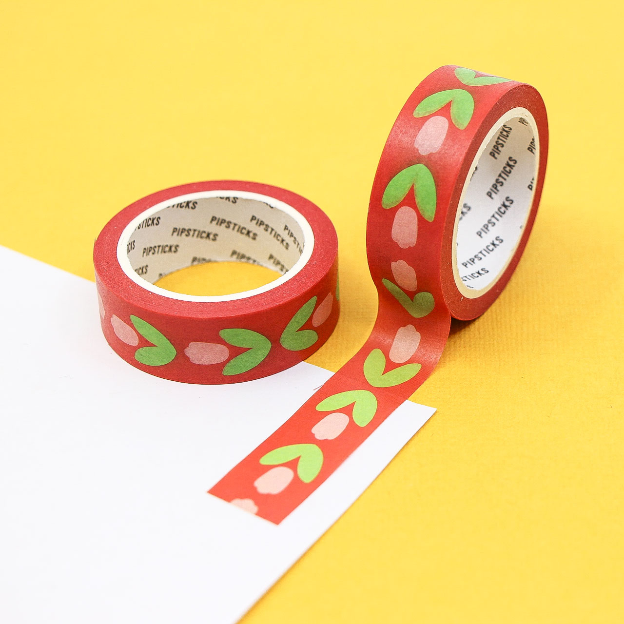 Red folk floral washi tape roll featuring hand-painted flower patterns