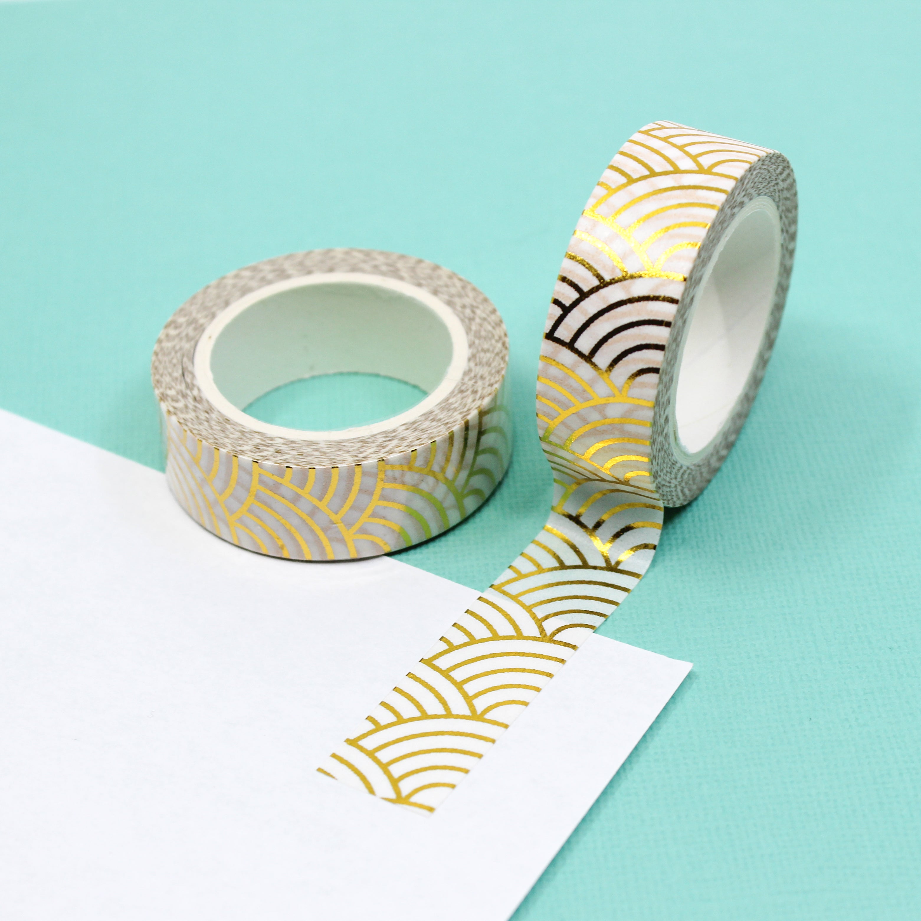 levate your crafts with our Gold Foil Scalloped Fish Scale Pattern Washi Tape, featuring a stylish fish scale design in shimmering gold foil. Ideal for adding a touch of glamour and elegance to your projects. This tape is sold at BBB Supplies Craft Shop.