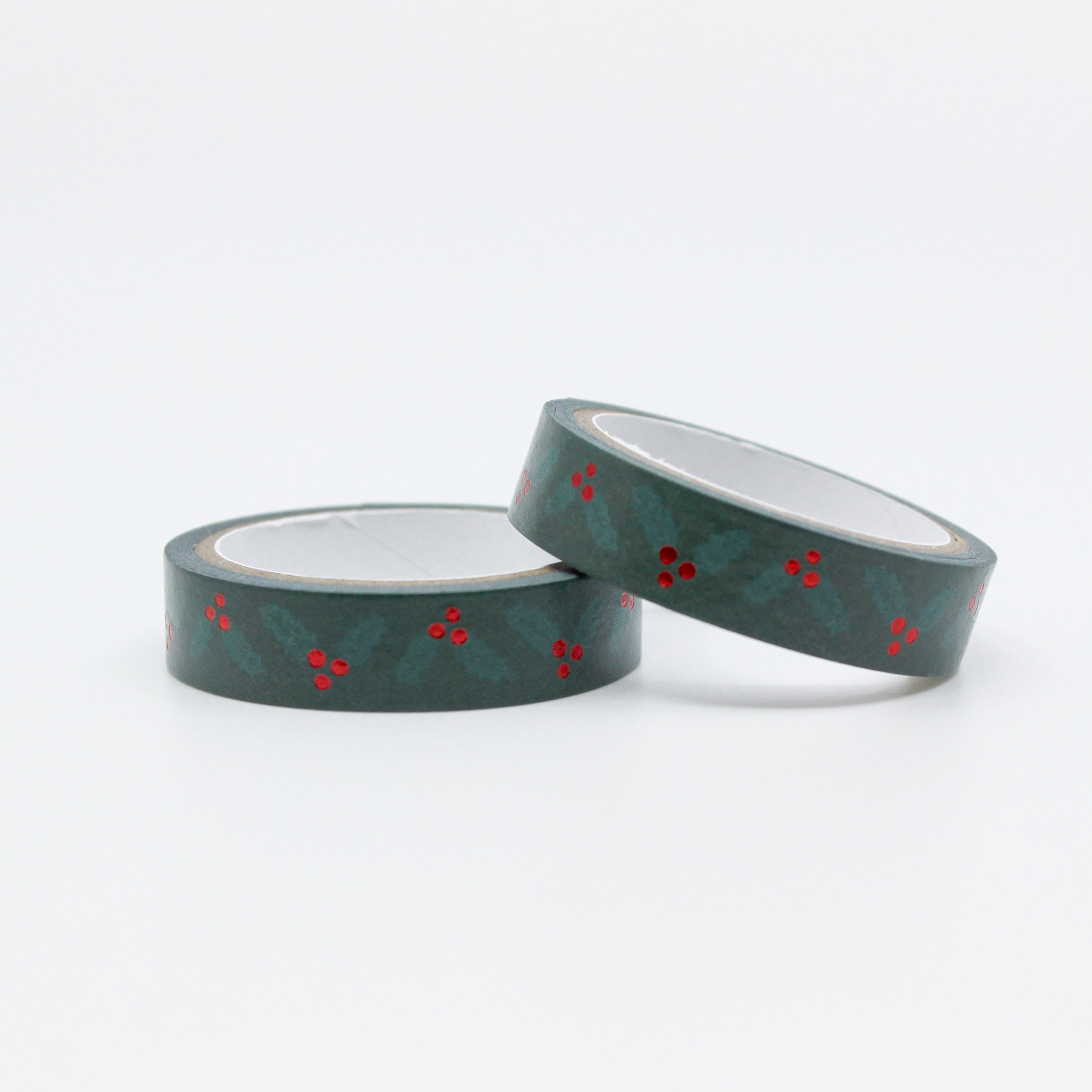 Elevate your holiday crafts with our narrow green holiday holly washi tape, featuring delicate holly leaf and berry designs, perfect for adding a touch of festive charm to your projects. This tape is sold at BBB Supplies Craft Shop.