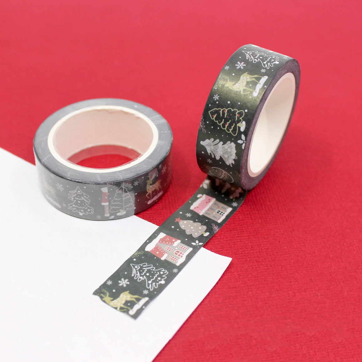 Decorate your holiday projects with this festive washi tape featuring a variety of Christmas objects. From ornaments to stockings, this tape is perfect for adding a touch of holiday cheer to your crafts. This tape is sold at BBB Supplies Craft Shop.