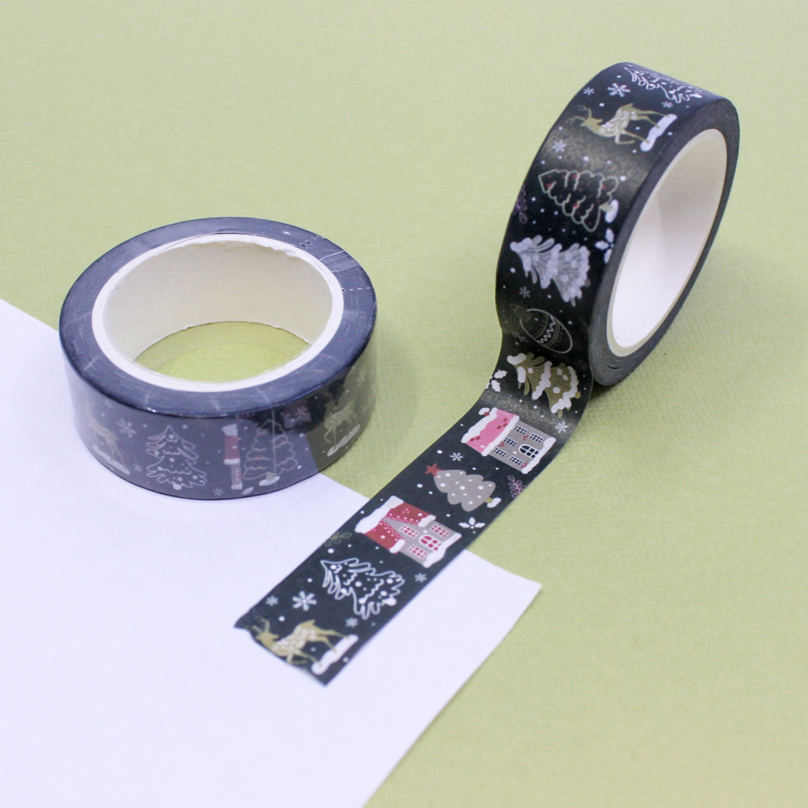 Decorate your holiday projects with this festive washi tape featuring a variety of Christmas objects. From ornaments to stockings, this tape is perfect for adding a touch of holiday cheer to your crafts. This tape is sold at BBB Supplies Craft Shop.