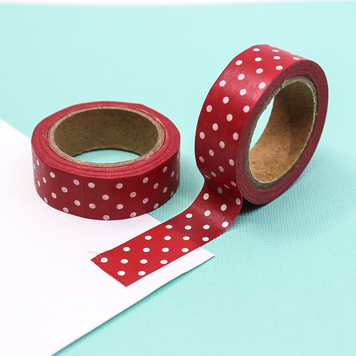 Red and White Polka Dot Washi Tape with a festive design, featuring a bright red background and white polka dots, ideal for holiday crafts and gift wrapping.