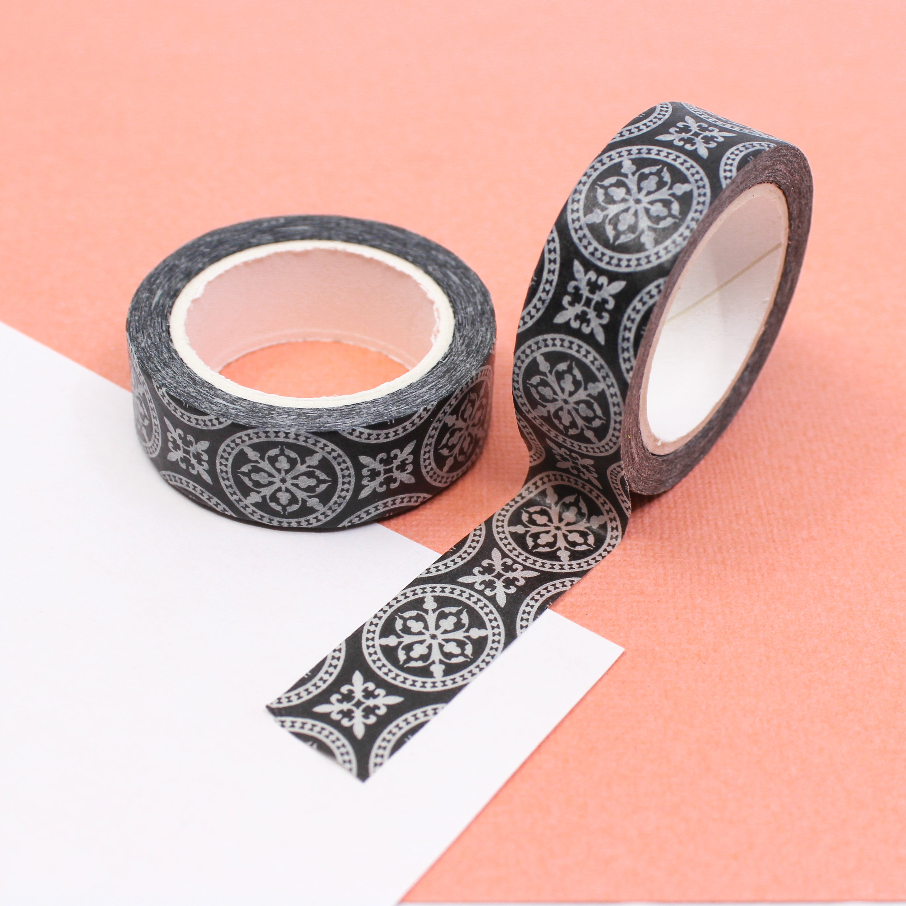 Add a touch of elegance to your crafts with our black and white medallion round repeat pattern washi tape, featuring a captivating and intricate design of repeating medallions in a classic black and white color scheme. This tape is sold at BBB Supplies Craft Shop.