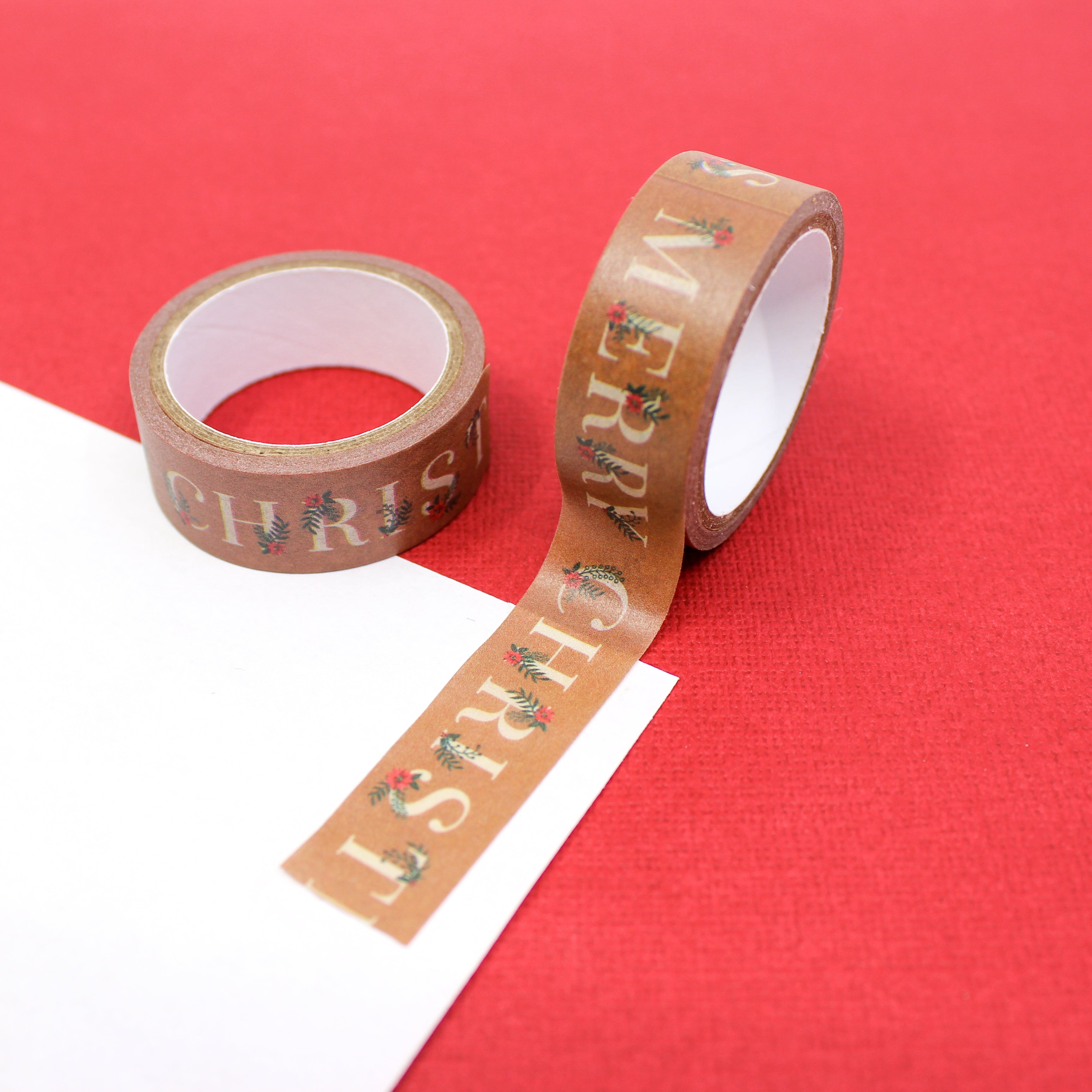 Elevate your holiday crafts with our 'Merry Christmas with Poinsettia' washi tape, featuring festive typography alongside charming poinsettia flower designs, perfect for adding a touch of seasonal cheer to your projects. This tape is sold at BBB Supplies Craft Shop.