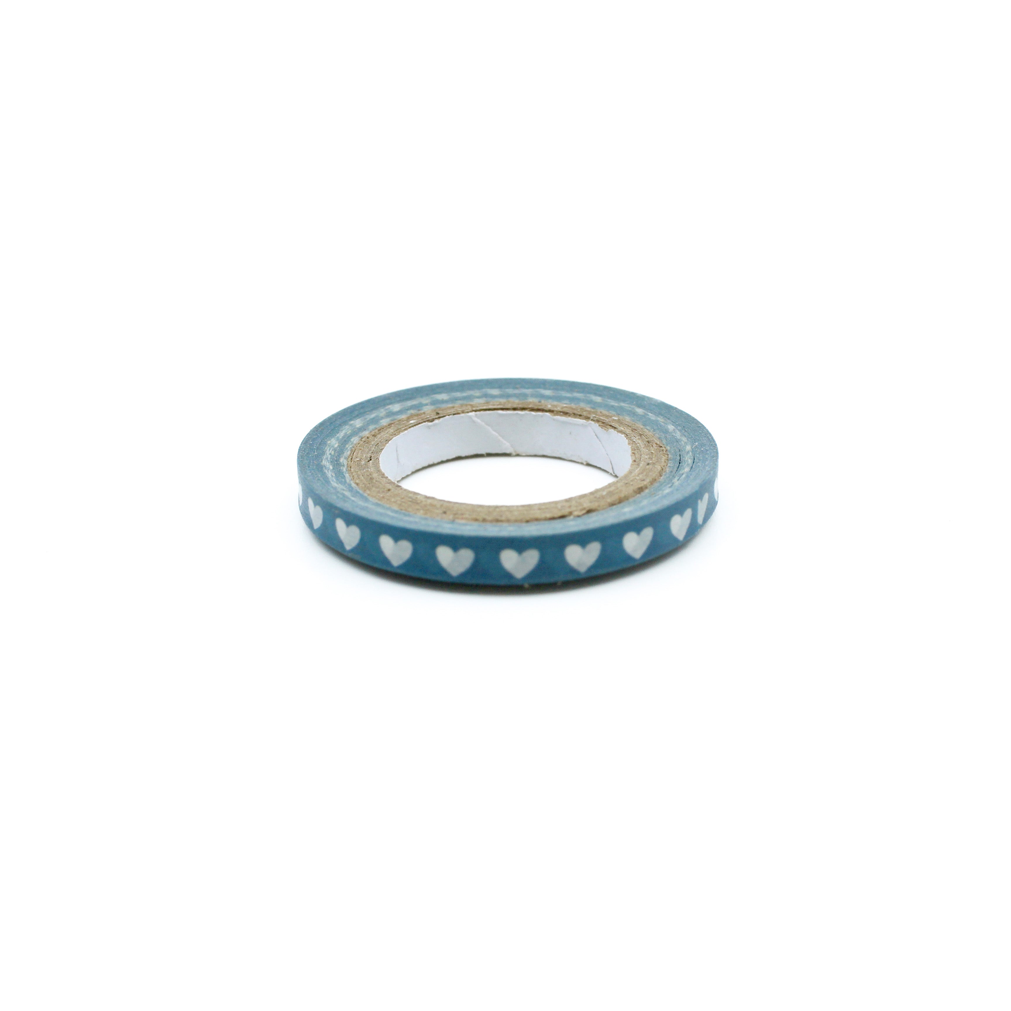 Elevate your crafts with our Narrow Blue Hearts Washi Tape, featuring a charming heart pattern in a calming shade of blue. Ideal for adding a sweet and decorative touch to your projects. This tape is sold at BBB Supplies Craft Shop.