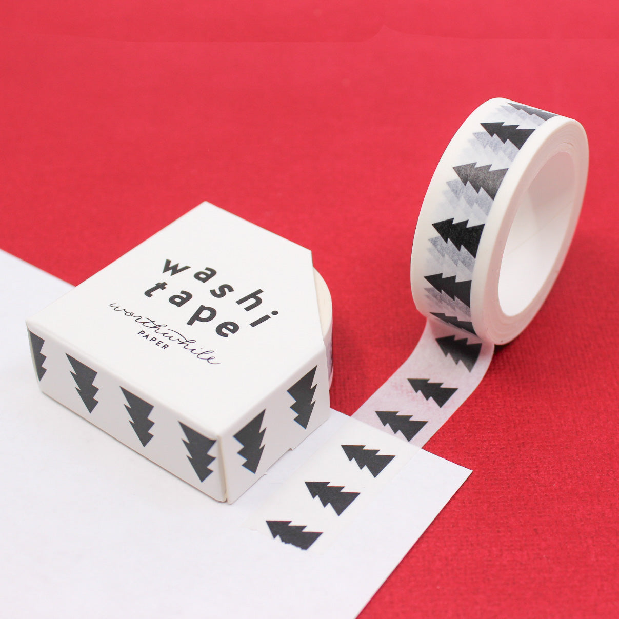 Black and White Nordic Holiday Pine Tree Washi Tape, featuring a charming winter design with stylized pine trees, ideal for adding a touch of Scandinavian elegance to your festive crafts and holiday-themed projects. This tape is from Worthwhile Paper and sold at BBB Supplies Craft Shop.