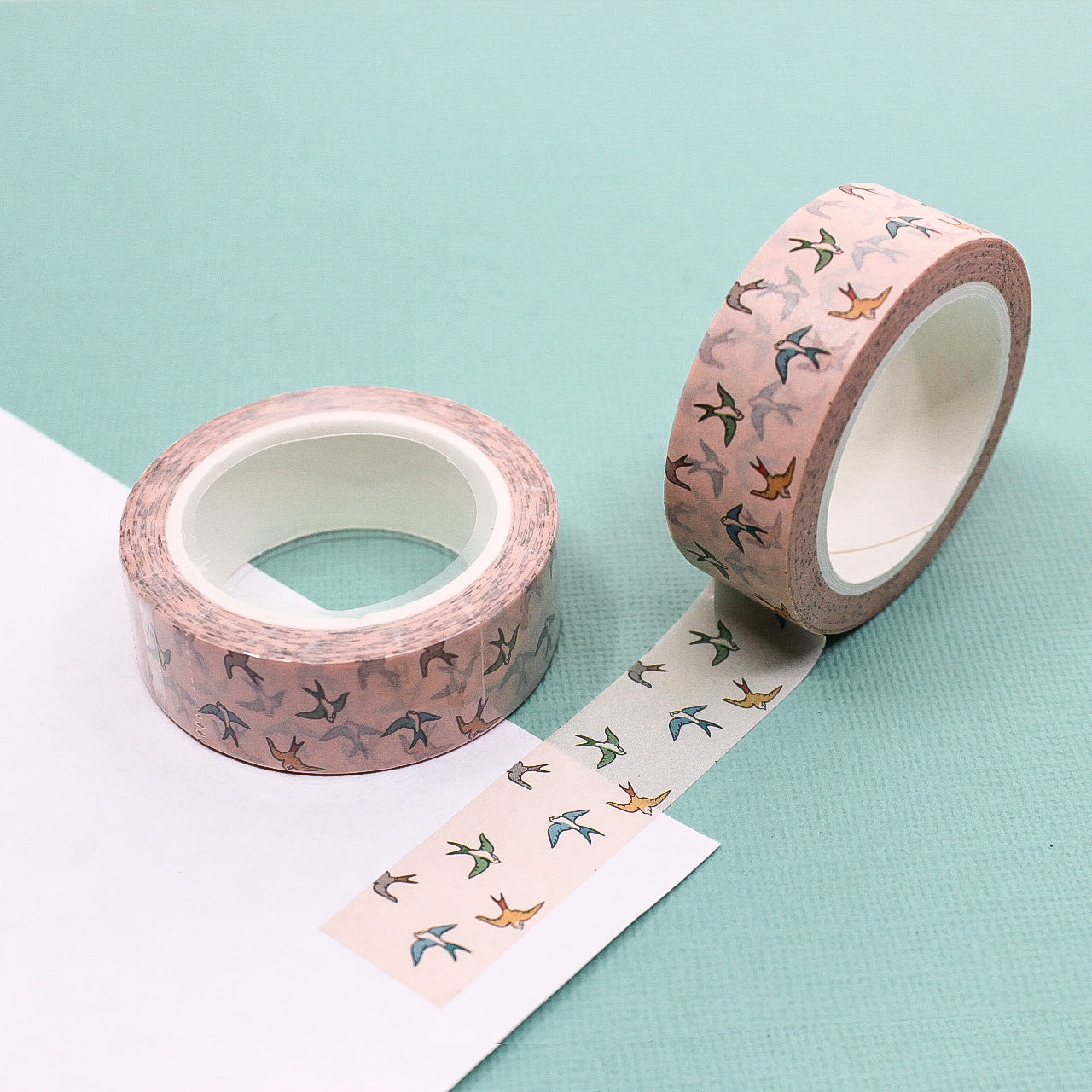 Decorate your projects with the delicate charm of these pastel sparrow birds. This washi tape features sweet sparrows in soft, muted colors, perfect for adding a whimsical touch to your crafts, journals, or scrapbooks. This tape is sold at BBB Supplies Craft Shop.