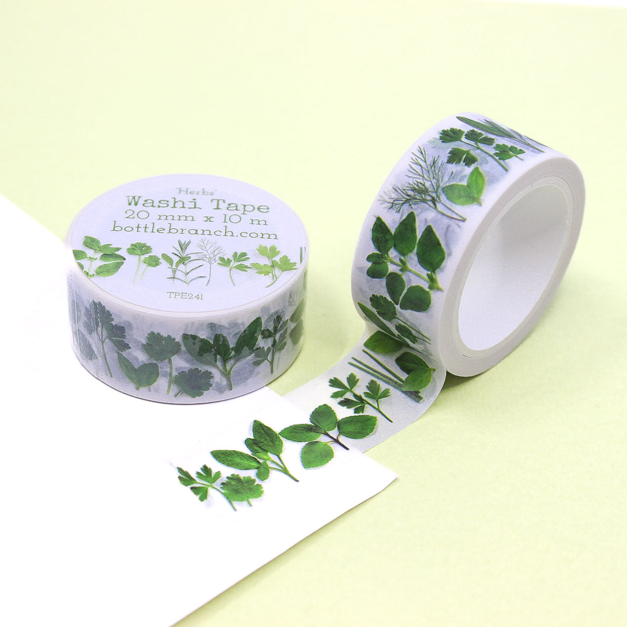Herbs washi tape roll featuring green leaf and plant illustrations.