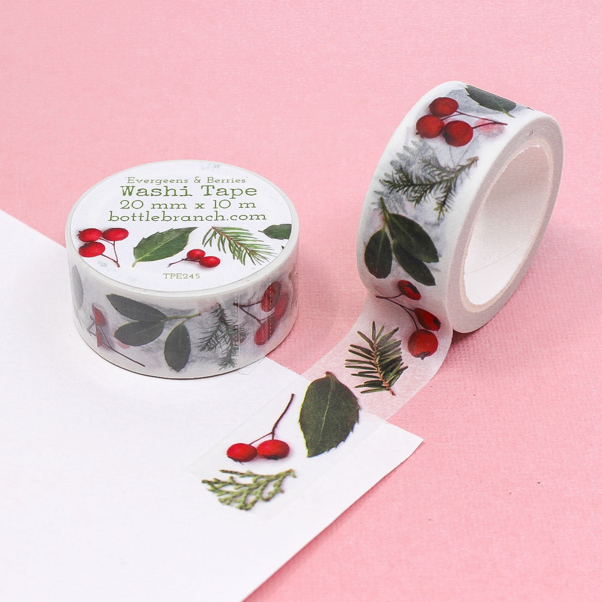 Christmas Festive botanical washi tape roll for holiday crafts and planner decoration.