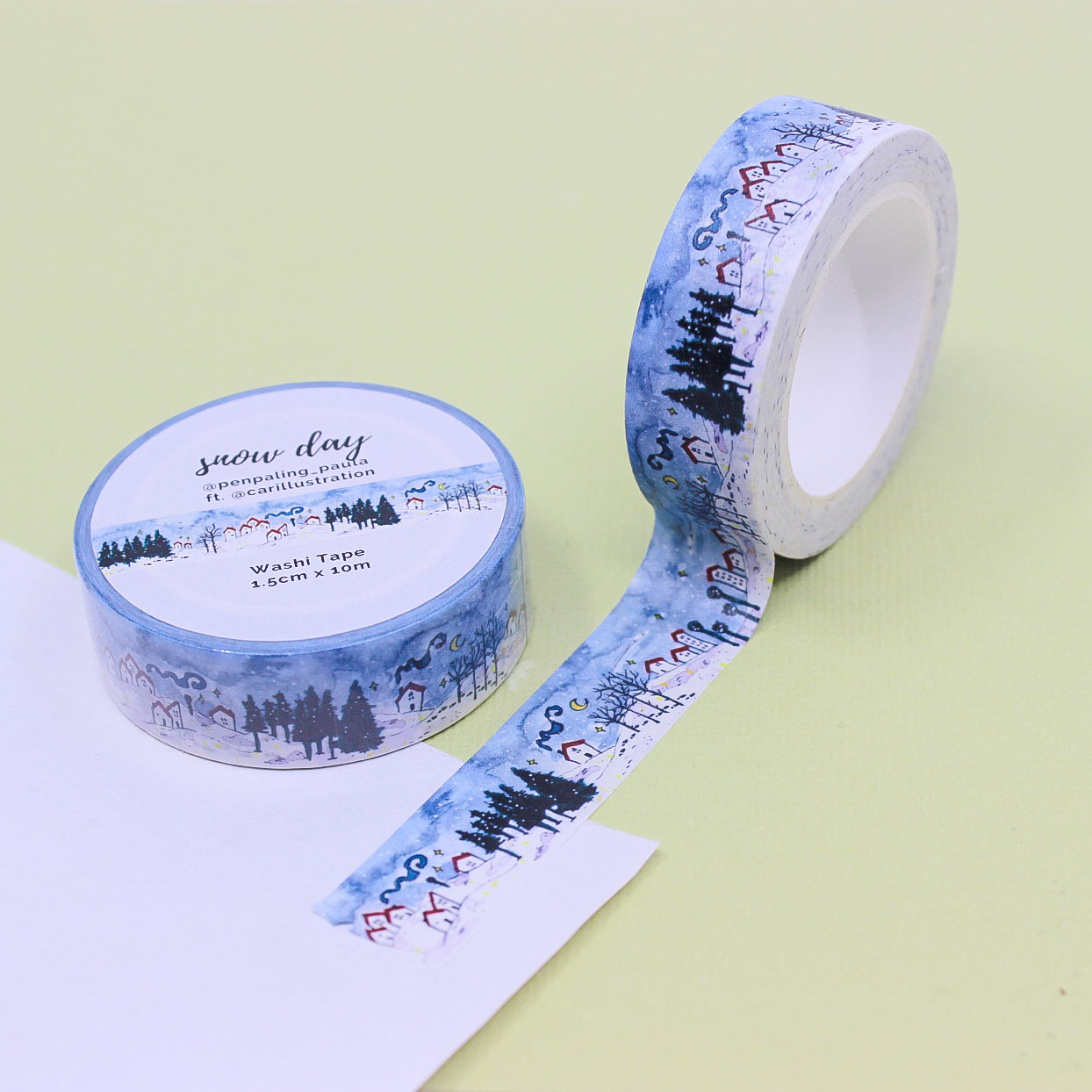 Snow Day Washi Tape featuring watercolor snowy village and pine forest on blue winter background.