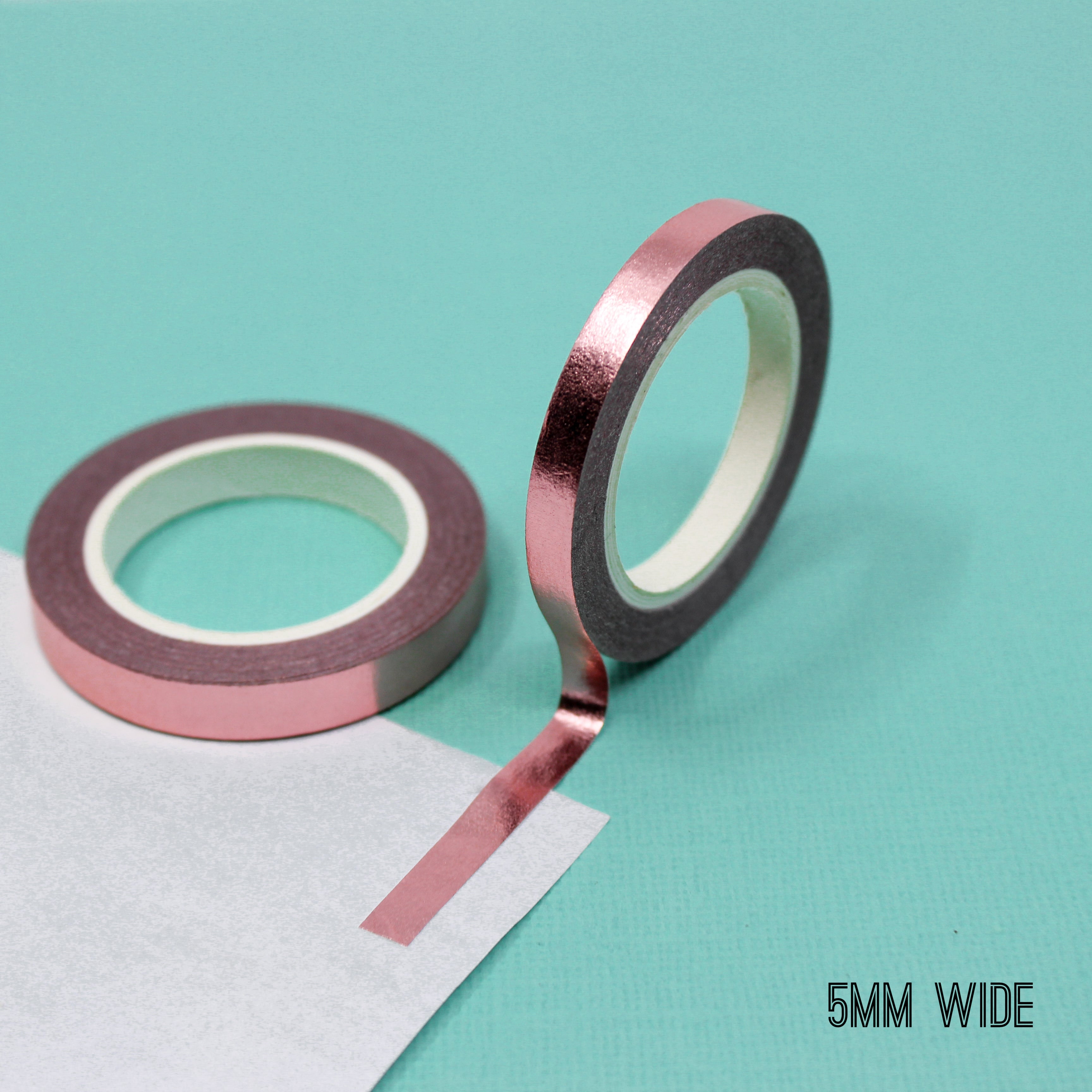 Elevate your creations with our captivating solid foil rose gold washi tape, showcasing a smooth and shiny surface in a radiant gold color, perfect for adding a touch of opulence and sophistication. This tape is sold exclusively at BBB Supplies Craft Shop.