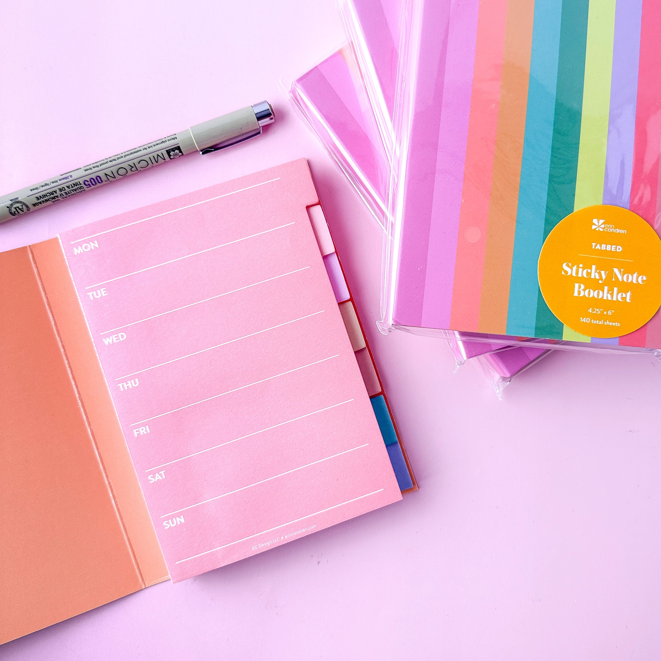 Planner sticky notes booklet shown next to a journal and pen for productivity planning from BBB Supplies.