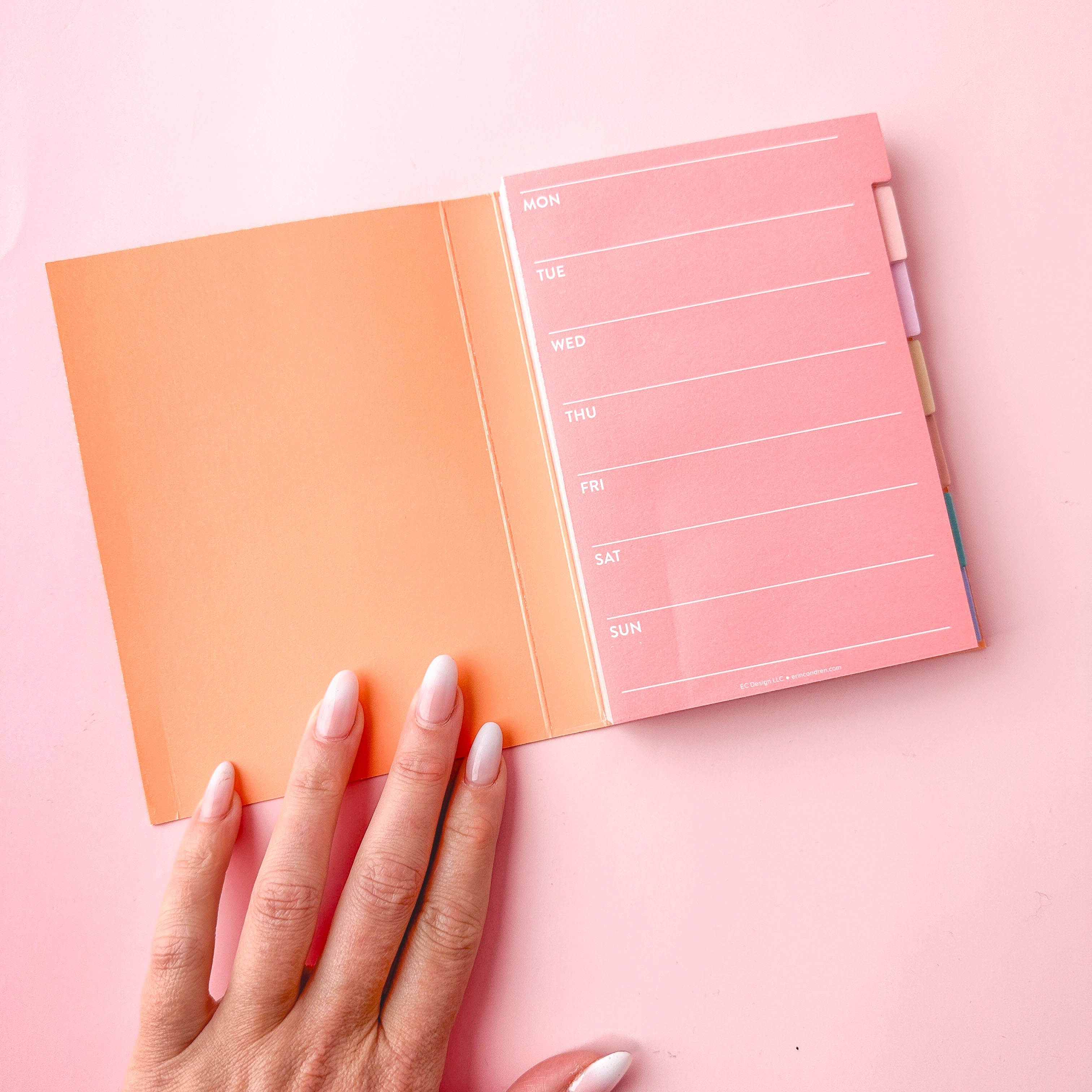Minimalist sticky note tabs used inside a bullet journal for page organization and marking