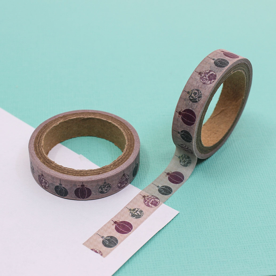 Thin decorative tape featuring hand-drawn Christmas ornaments in muted colors.