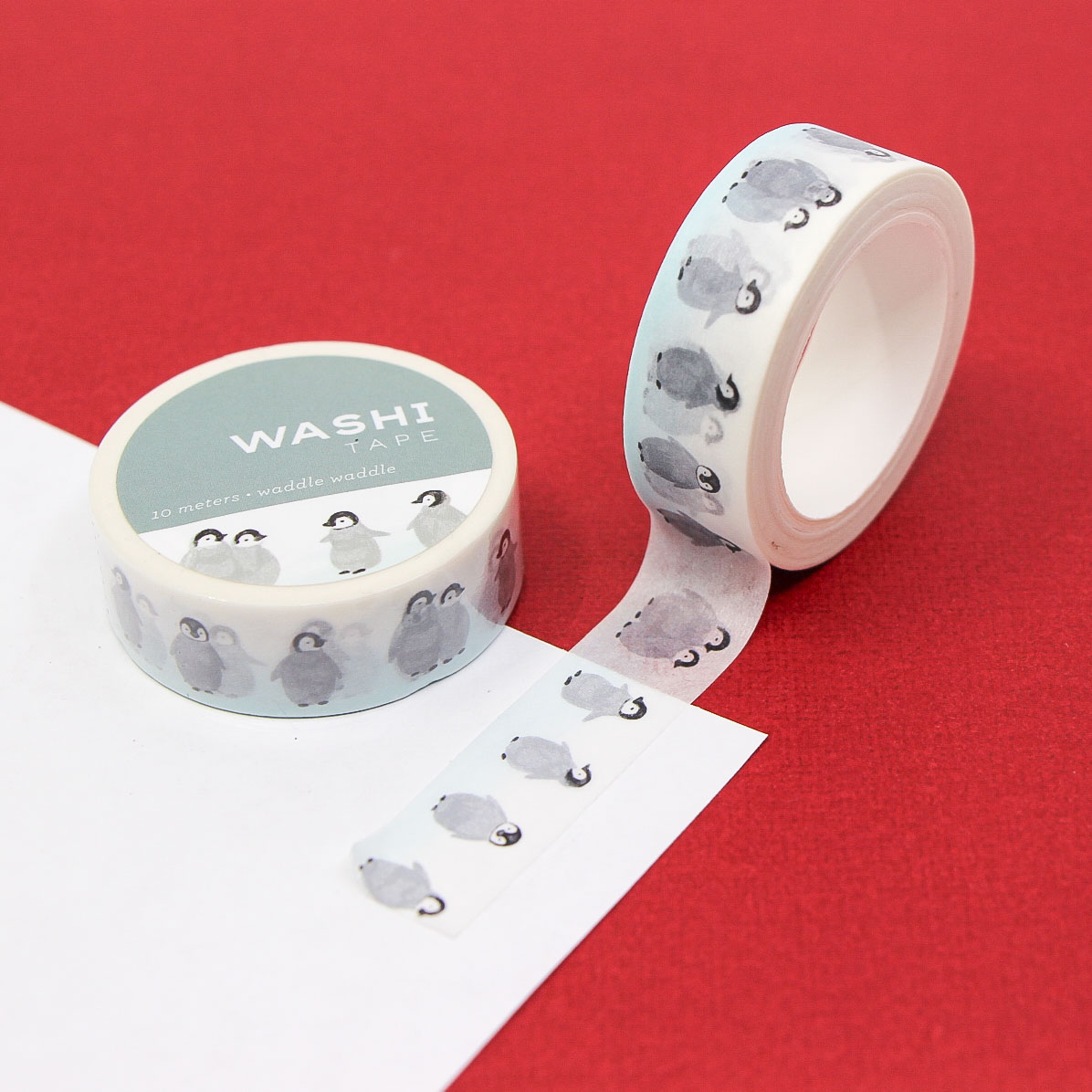 Waddle Waddle Washi Tape featuring cute baby penguins on a white background.