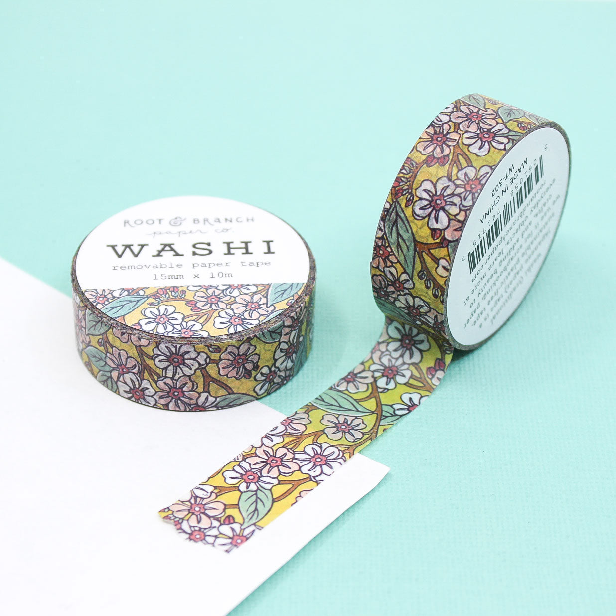 This Pink Blooms Washi Tape features a vibrant yellow backdrop adorned with beautiful pink and white blossoms and foliage, creating a cheerful and lively design. This colorful washi tape is perfect for adding a pop of color and a touch of nature-inspired beauty to your planners, journals, and craft projects