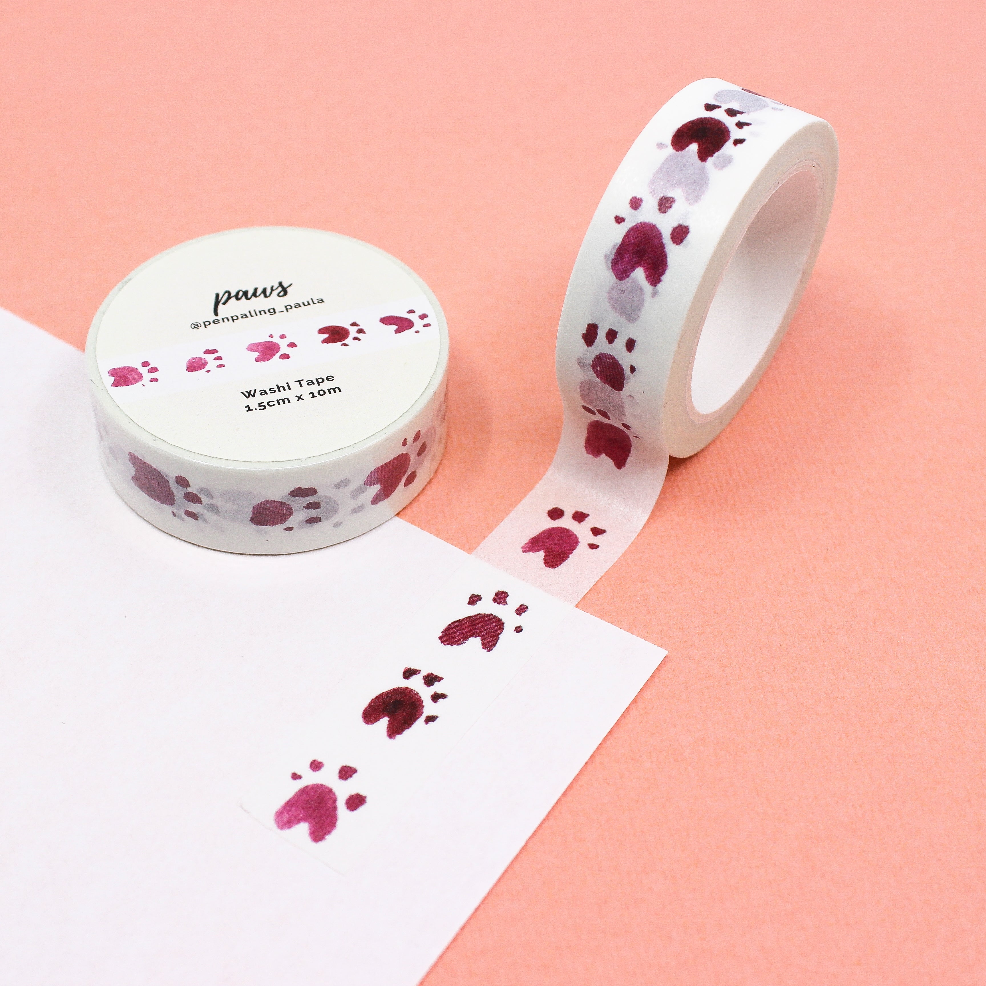 This is a pink and white animal paw prints of dog or bear washi tape from BBB Supplies Craft Shop