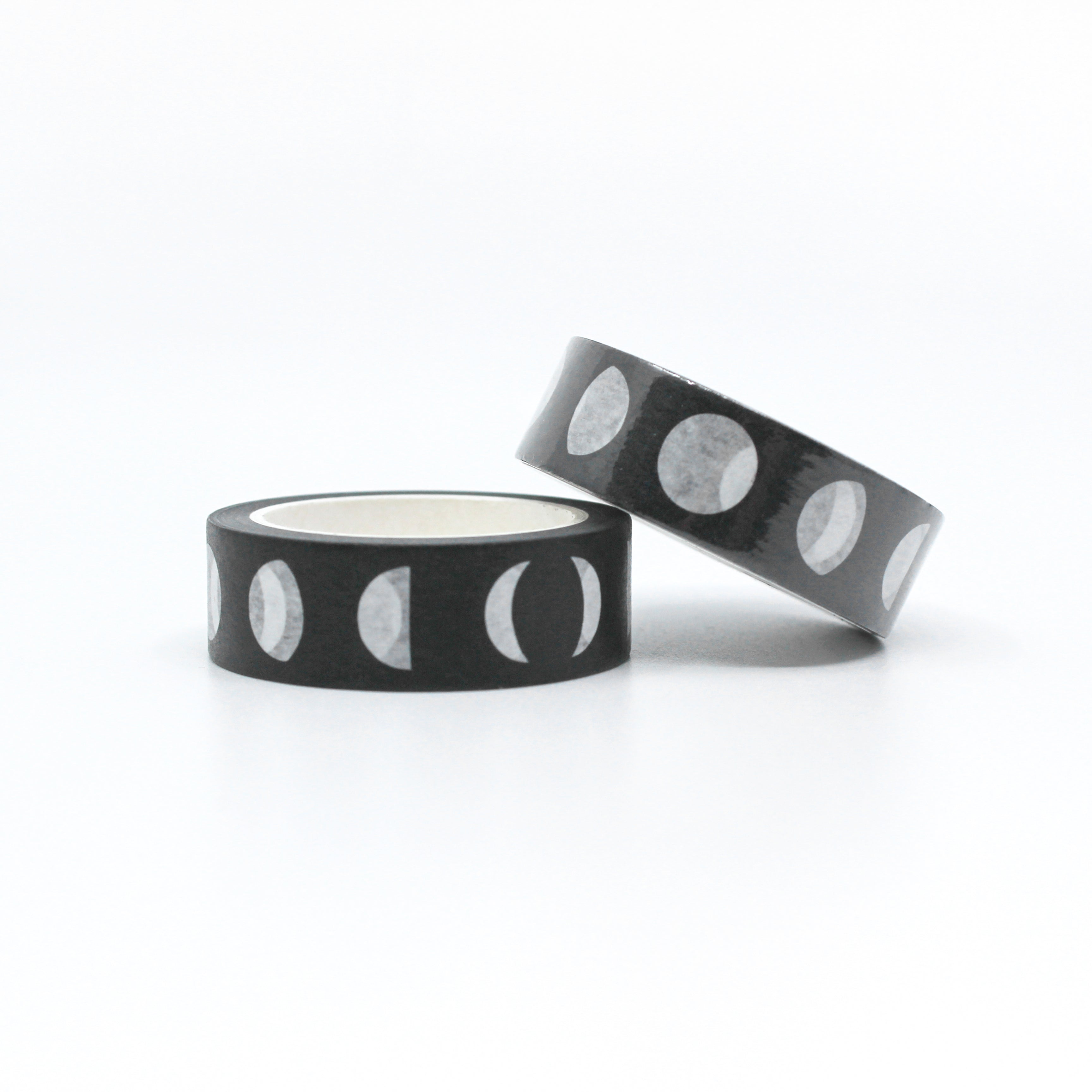 This photo shows you two washi tapes with black and white moon cycle pattern on them from BBB Supplies Craft and journaling Supplies shop.