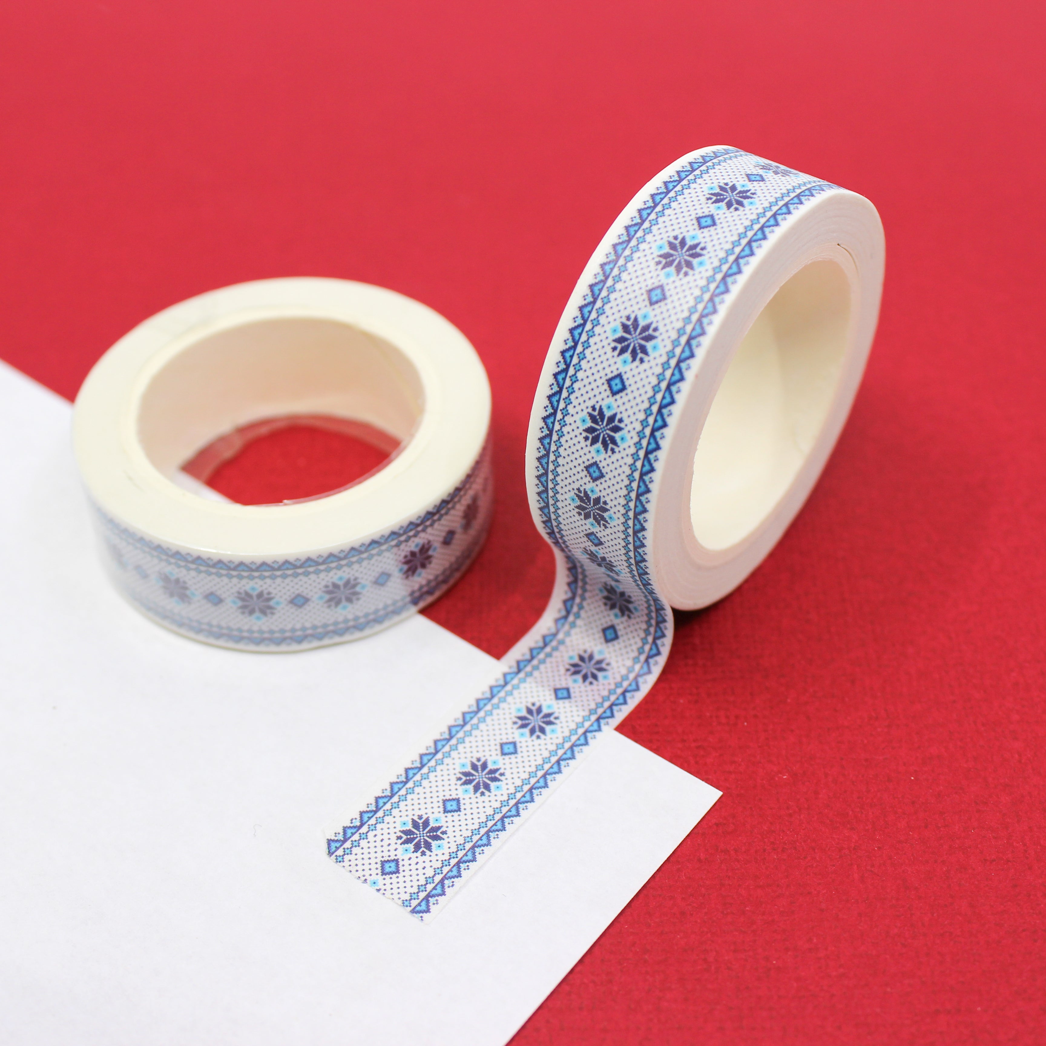 This cute blue washi tape is perfect for sweater weather. The blue and white winter cross stitch pattern will bring joy to any craft project, BUJO or planner spread. This tape is sold at BBB Supplies Craft Shop.