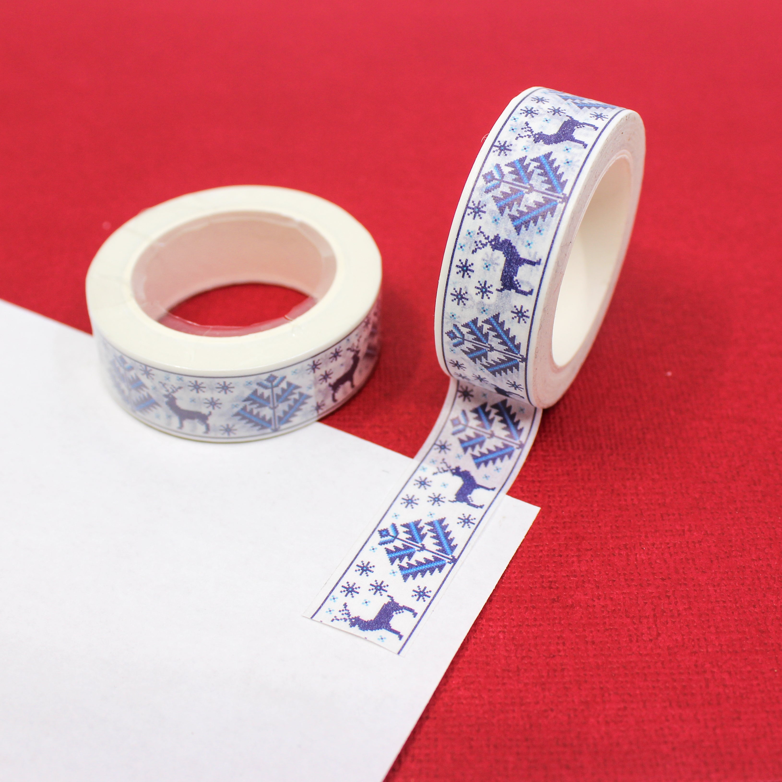 This cute blue deer washi tape is perfect for sweater weather. The blue and white winter cross stitch pattern will bring joy to any craft project, BUJO or planner spread. This tape is sold at BBB Supplies Craft Shop. 