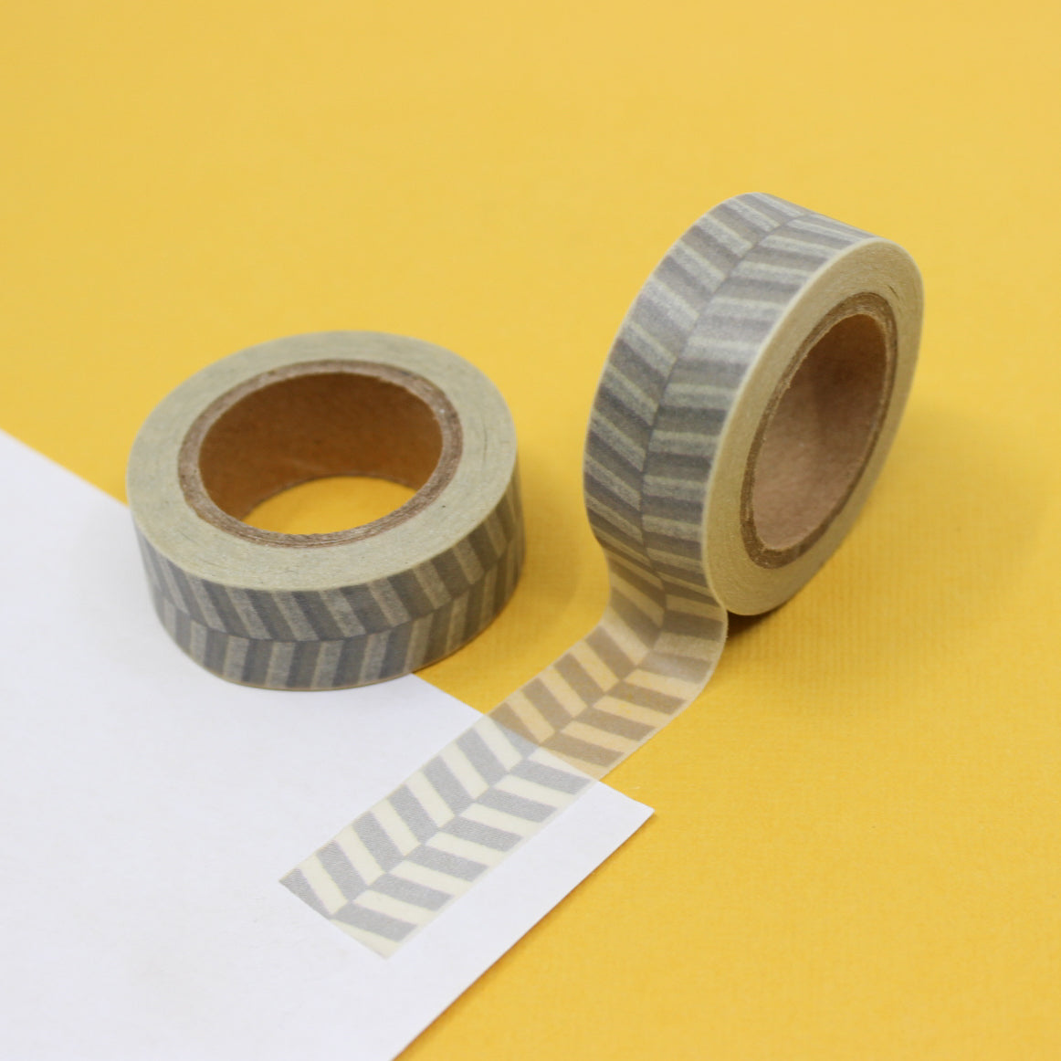 This fun and unique grey chevron color block pattern resemble a zipper. It will make a super cute addition to your washi collection. We sell this style of chevron tape in Yellow, brown and grey in our shop. This tape is sold at BBB Supplies Craft Shop.