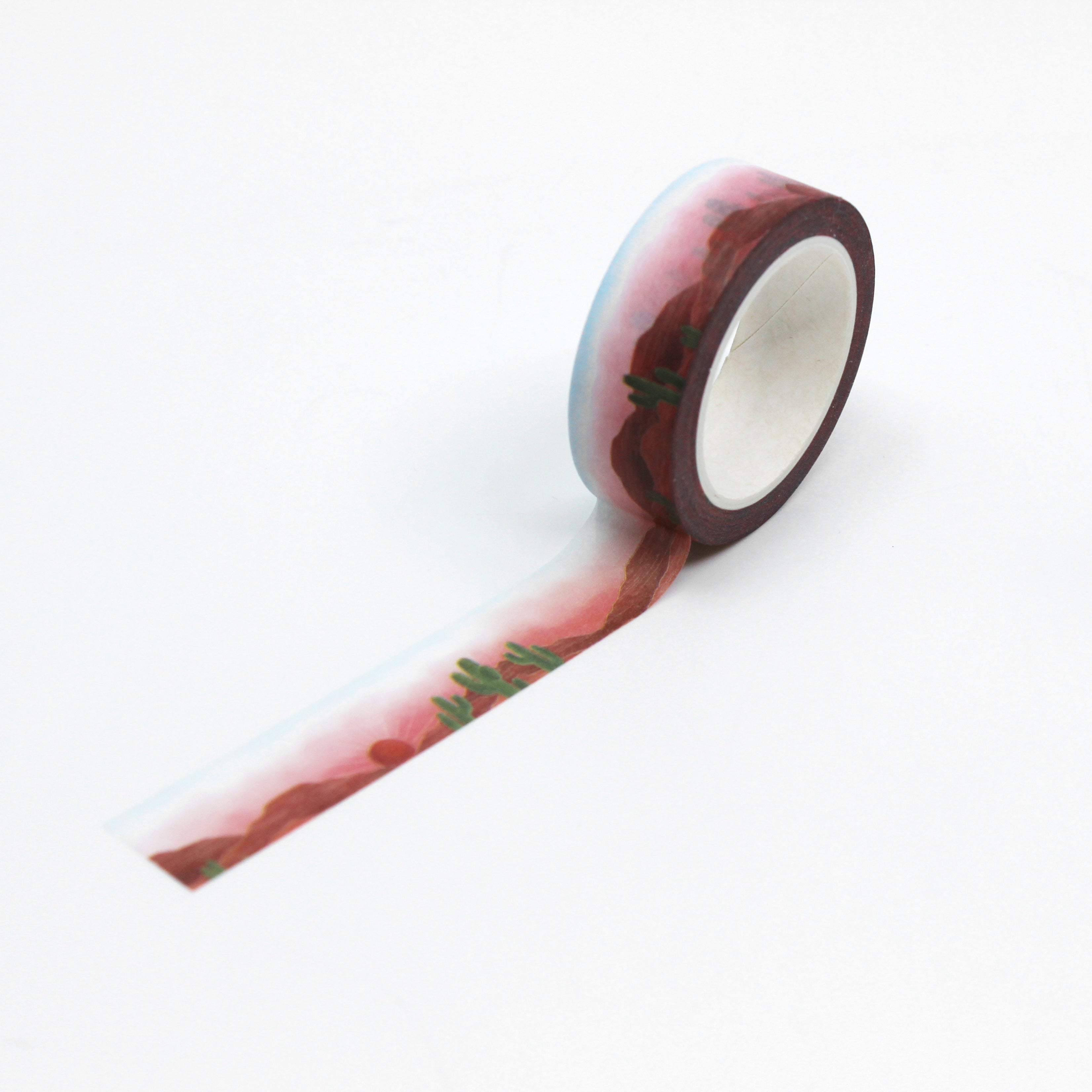 This is a full pattern repeat view of a vibrant pink sunset desert landscape washi tape from BBB Supplies Craft Shop