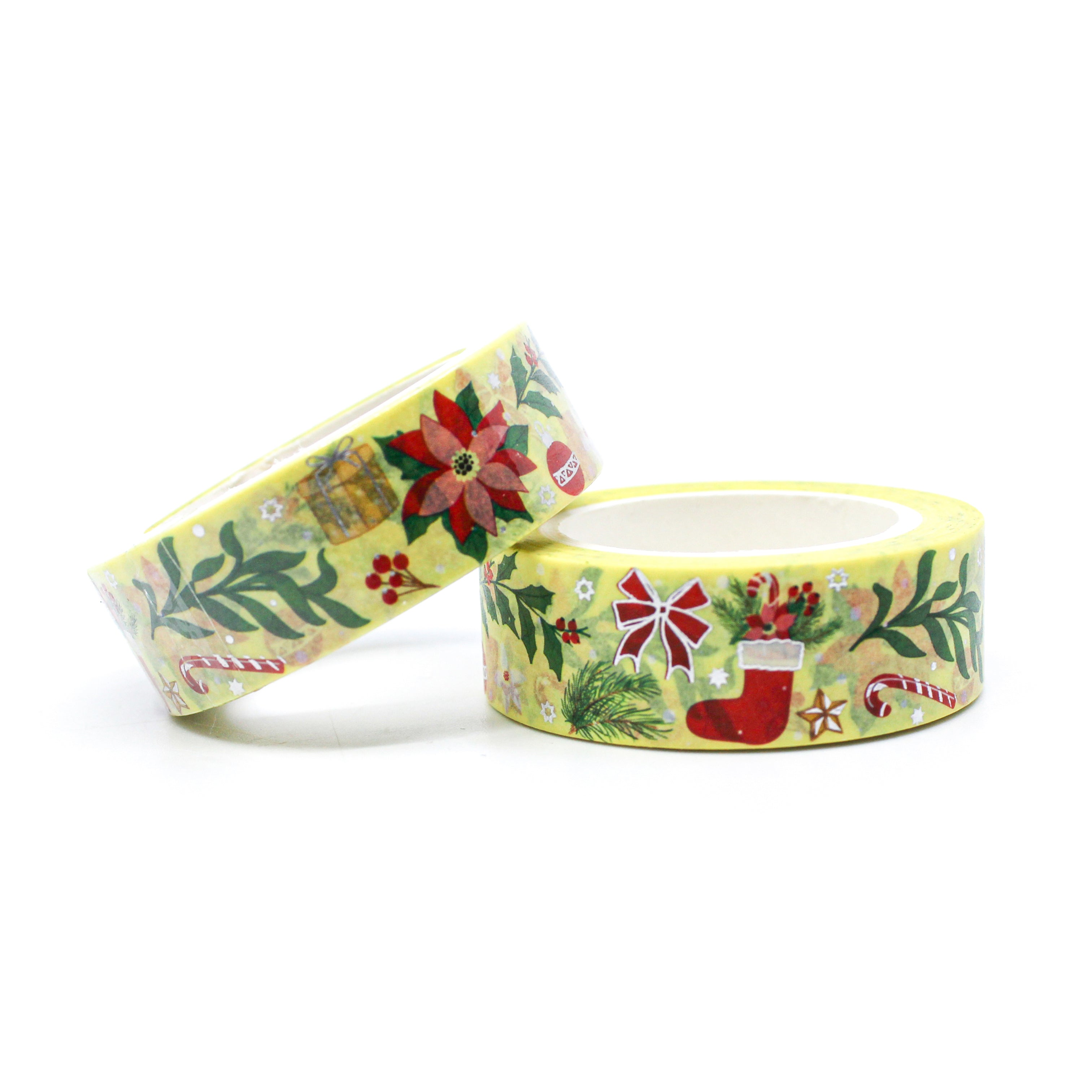 This is a warm yellow Holiday tape with silver foil accents that includes symbols of Stockings, Candy Canes, Poinsettias, and holiday foliage. 