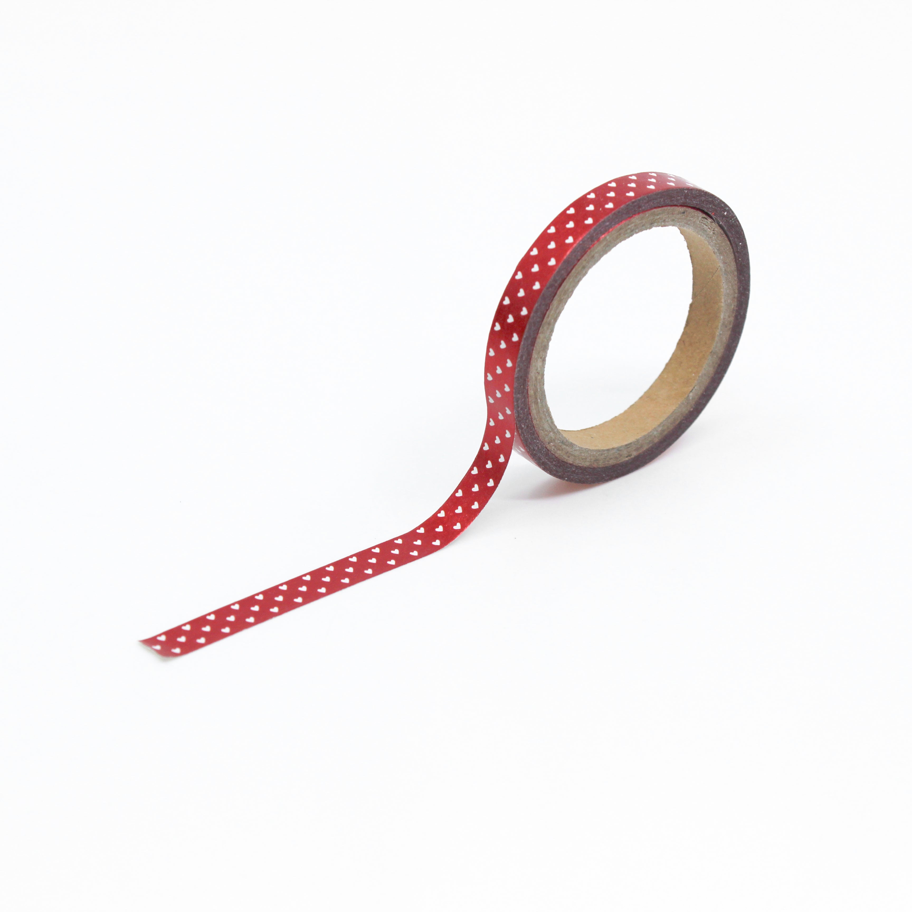 This is a full pattern repeat view of red tiny hearts foil themed washi tape from BBB Supplies Craft Shop